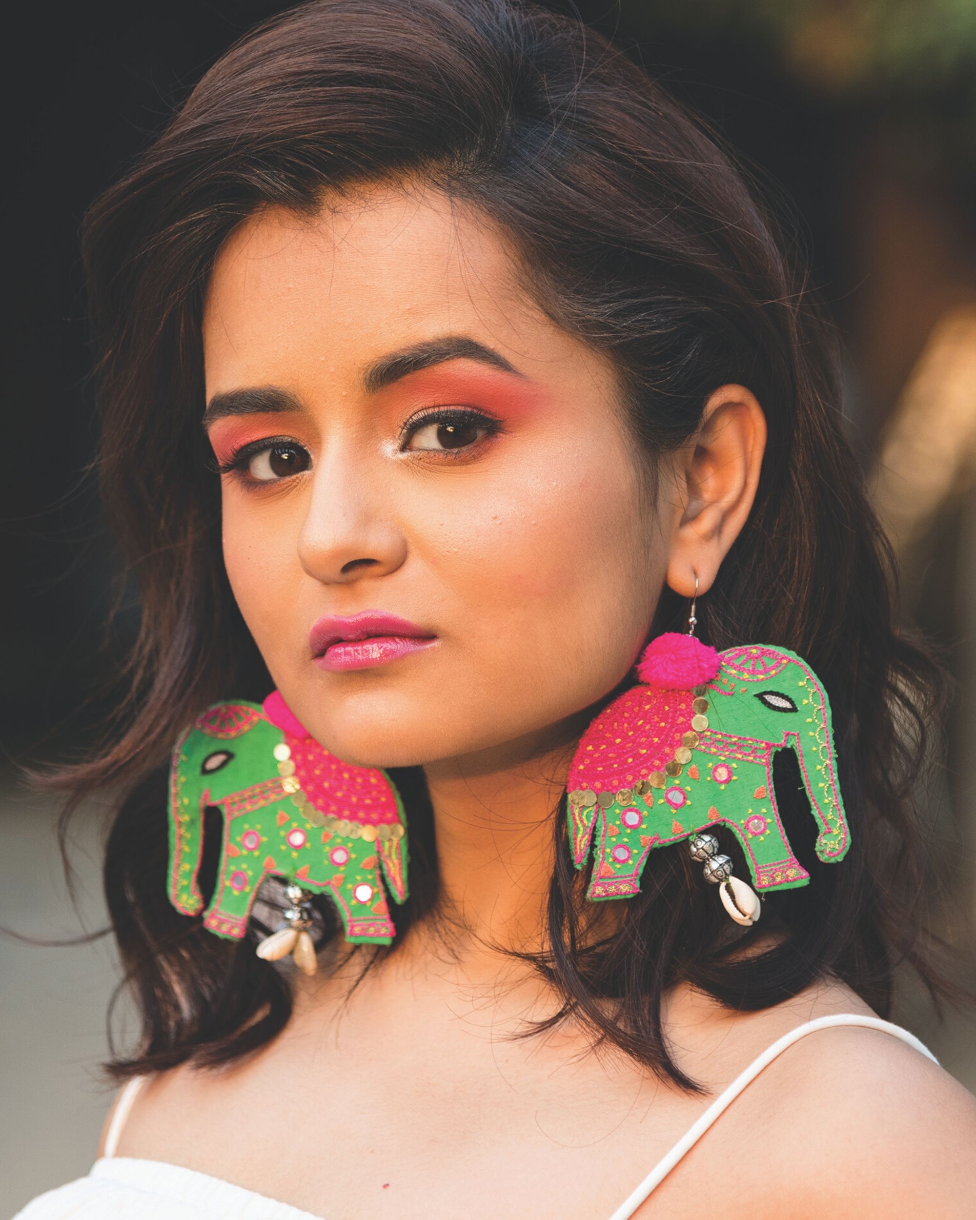 Green embroidered elephant earrings