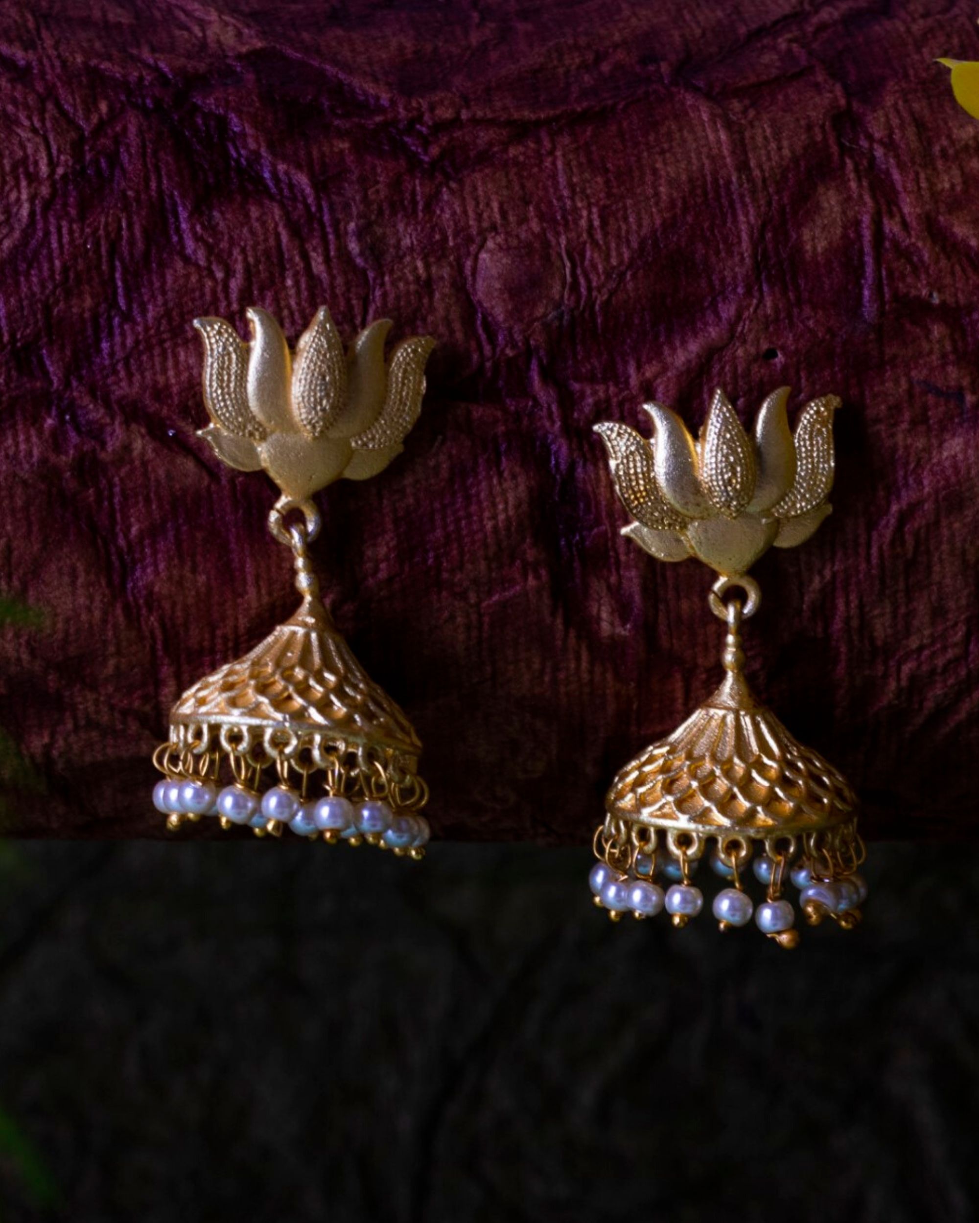 Lotus motif brass jhumka with pearl beads