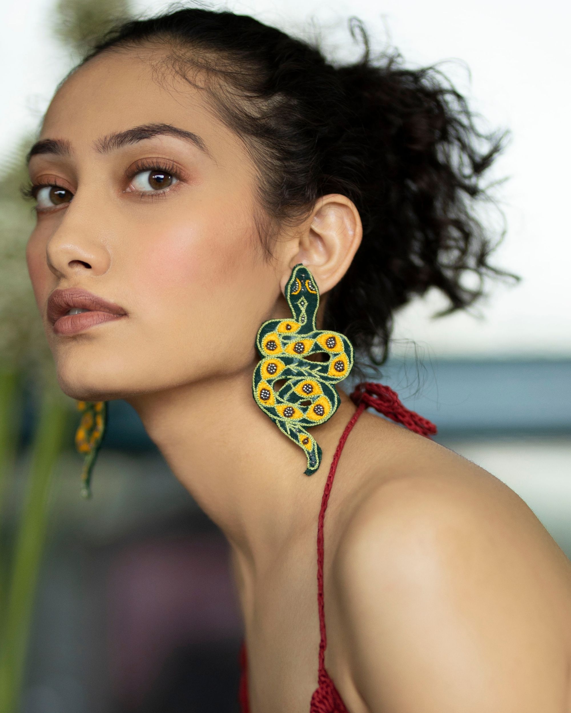 Green and yellow serpent embroidered earring
