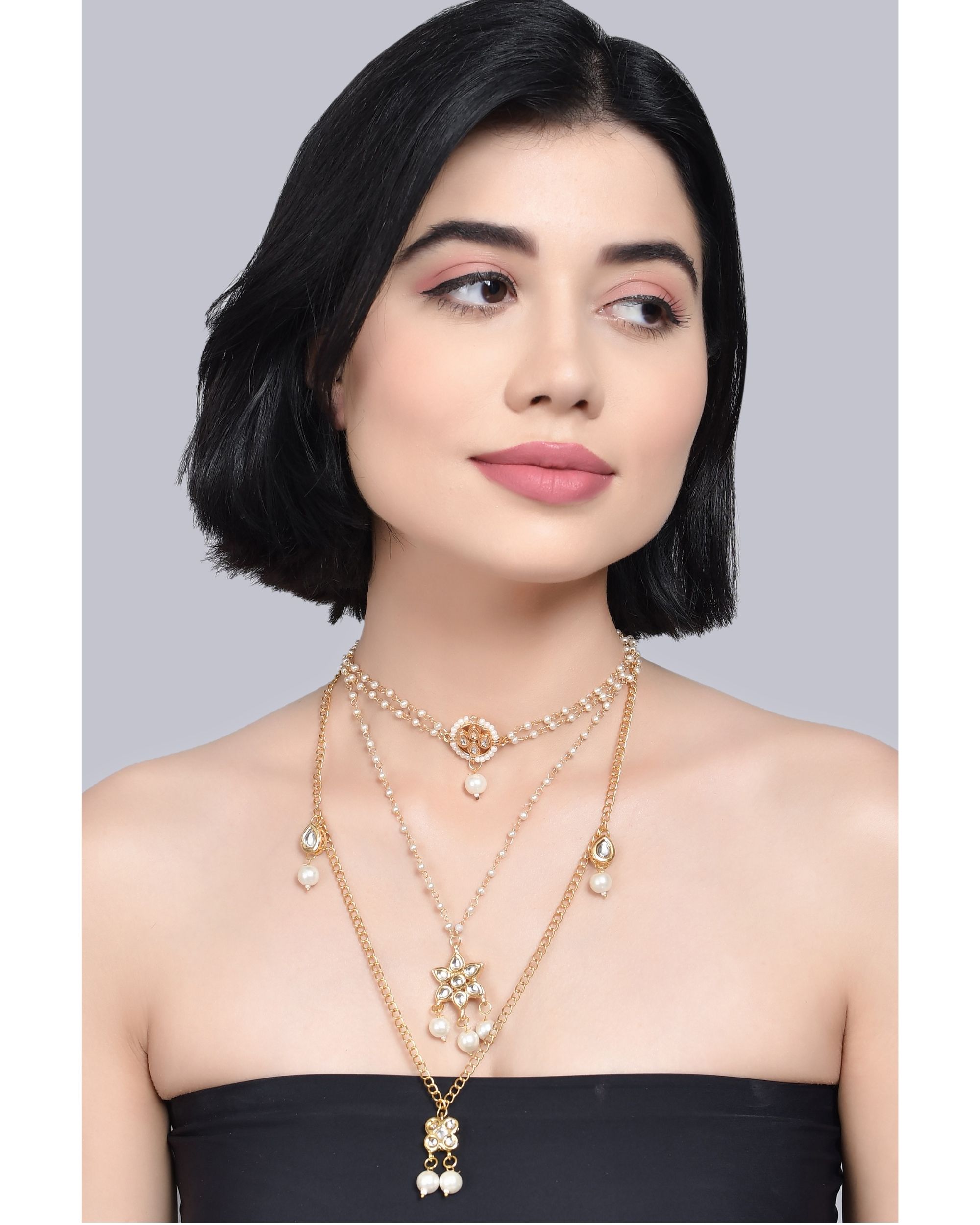Multilayered pearl beaded kundan embellished necklace teamed with choker