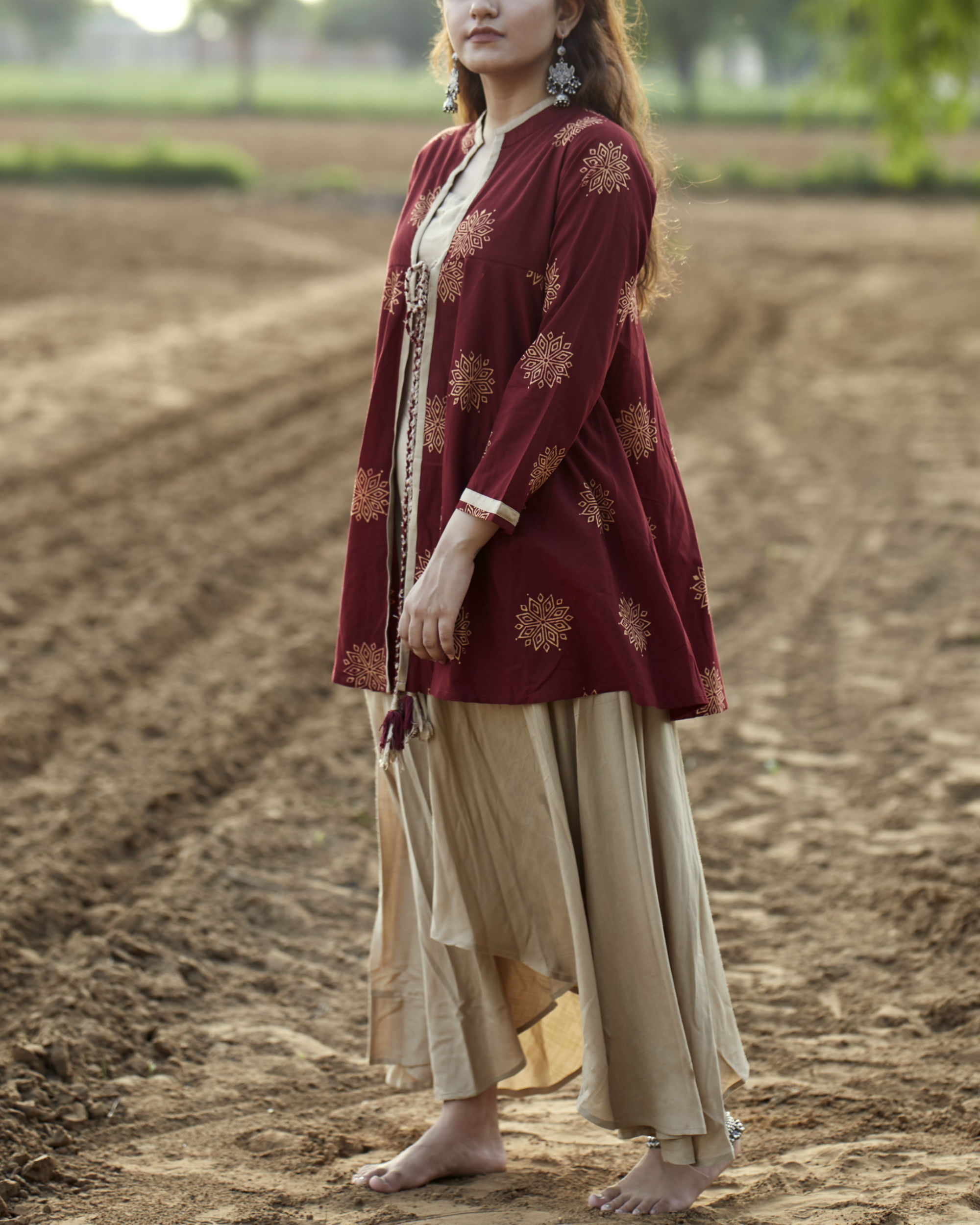Maroon peplum jacket and maxi set by Label Harsha Khatry The