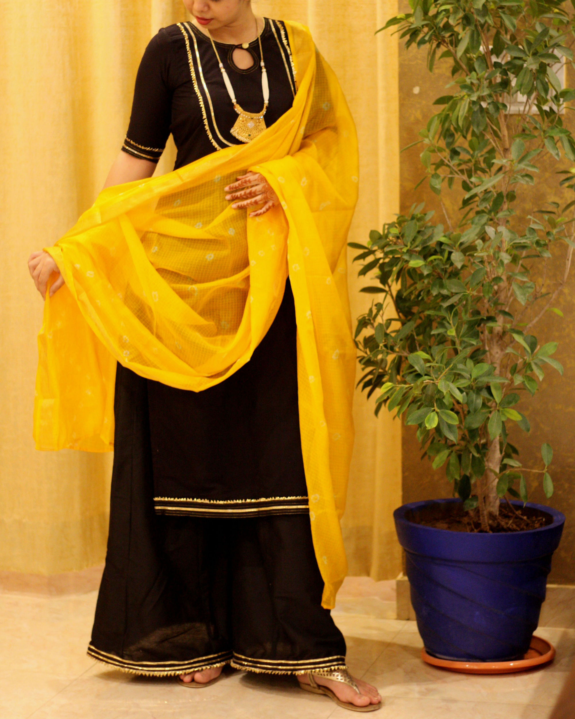 black suit with yellow dupatta