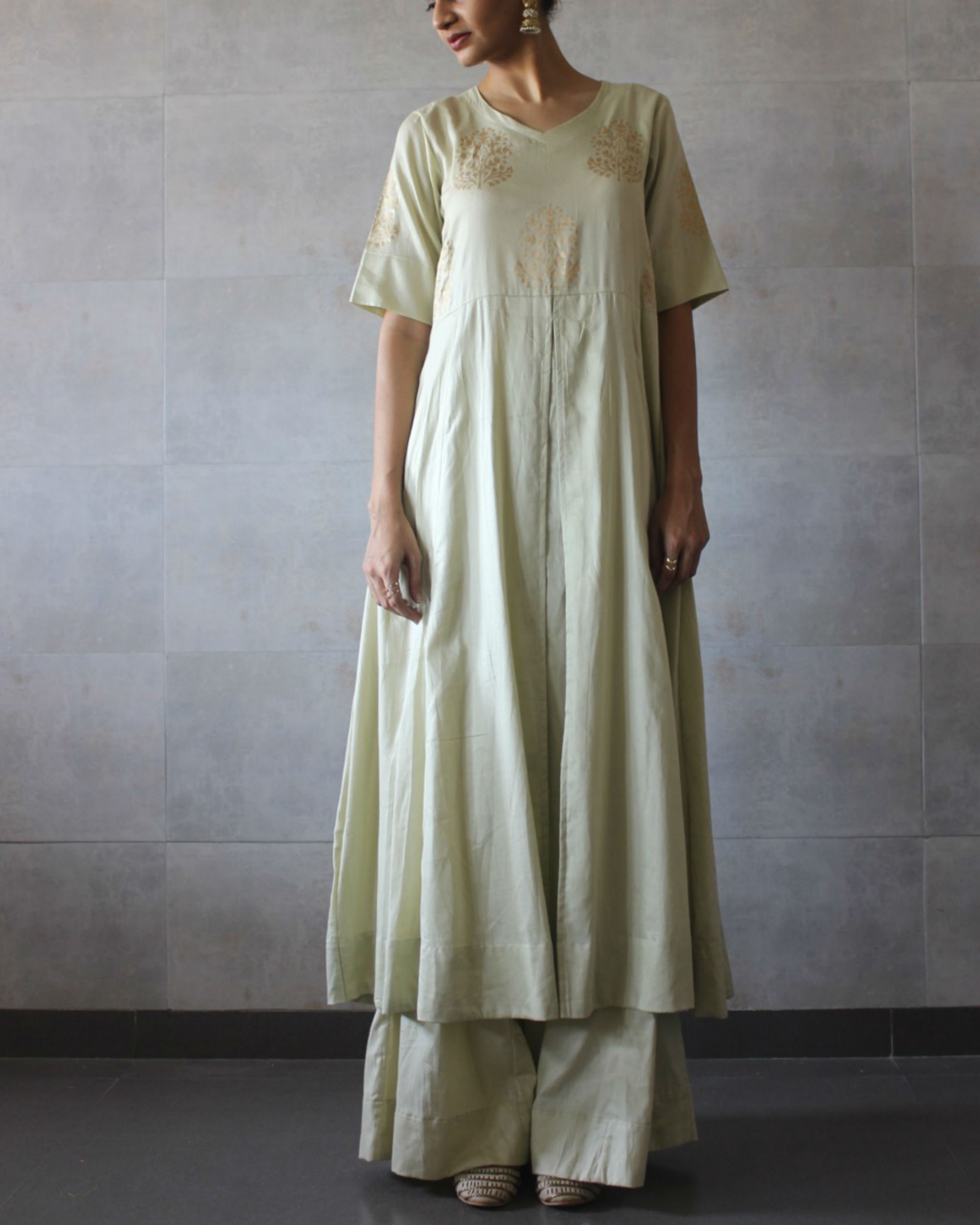 Ivory box pleated kurta by The Label Studio The Secret Label