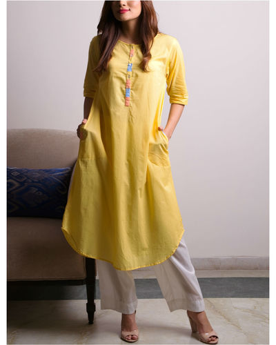 Yellow cutwork embroidered kaftan style kurta with white pants - set of two  by Keva | The Secret Label