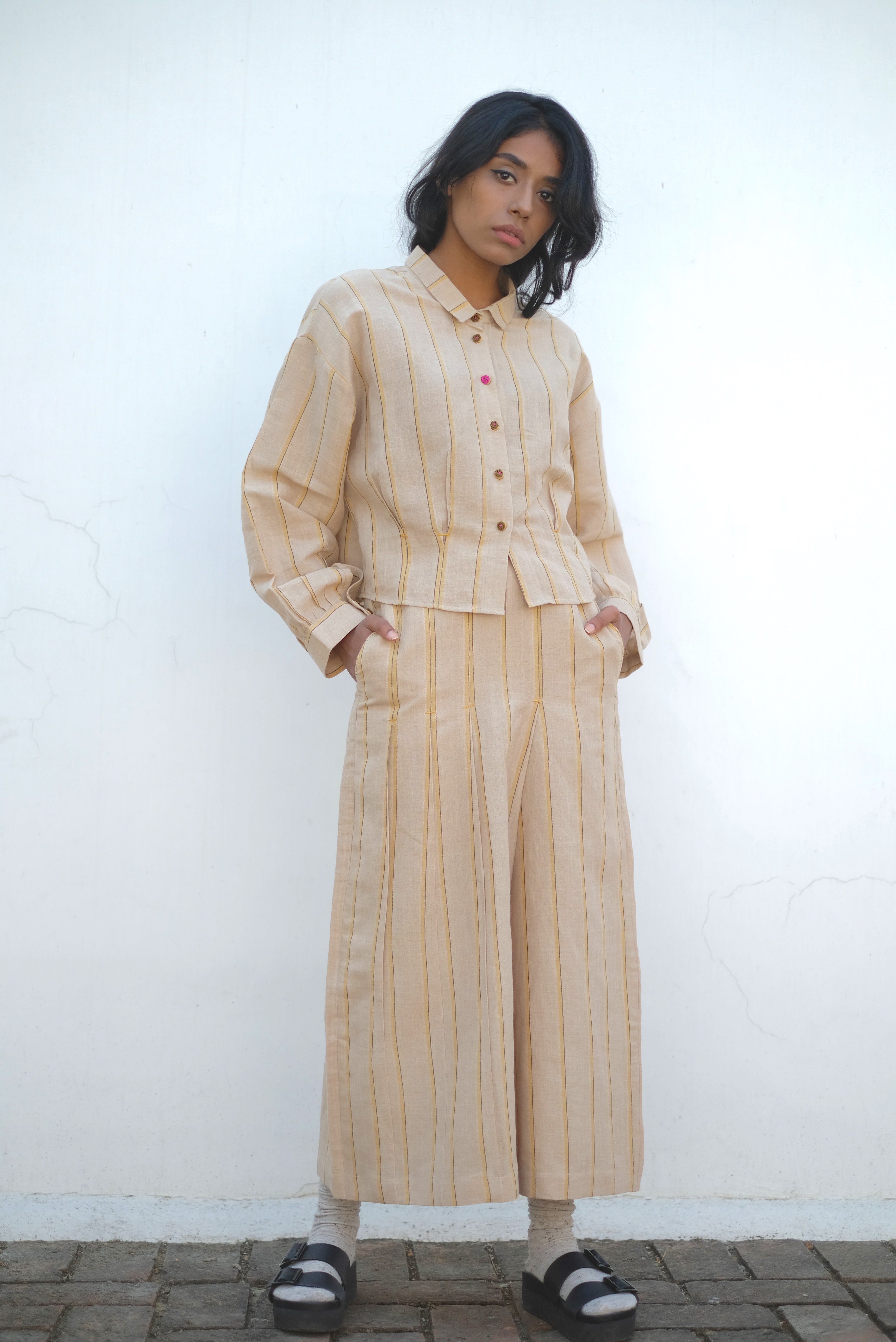 Asymmetrical pleated skirt pants by Twofold The Secret Label