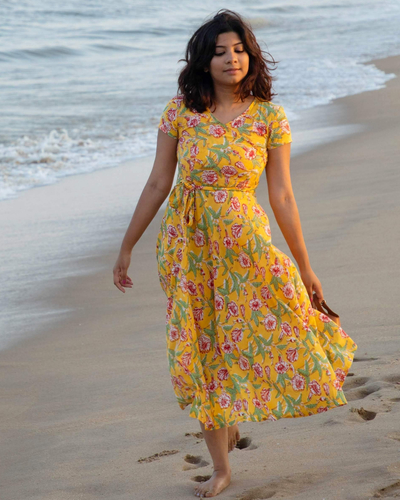 Yellow floral tie-up dress by Athira Designs