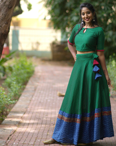 green skirt and crop top