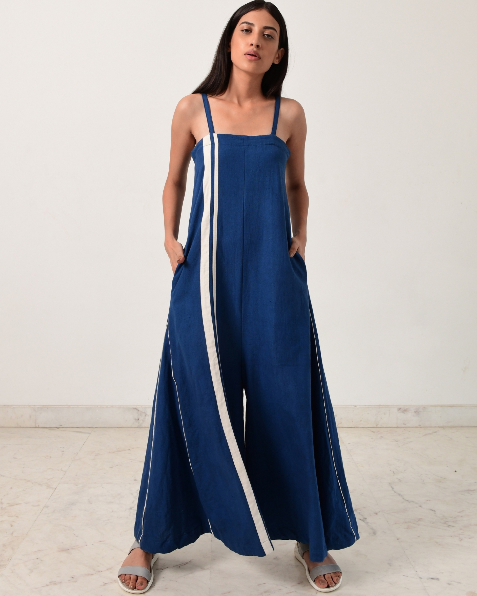 Indigo jumpsuit with fire strap piping