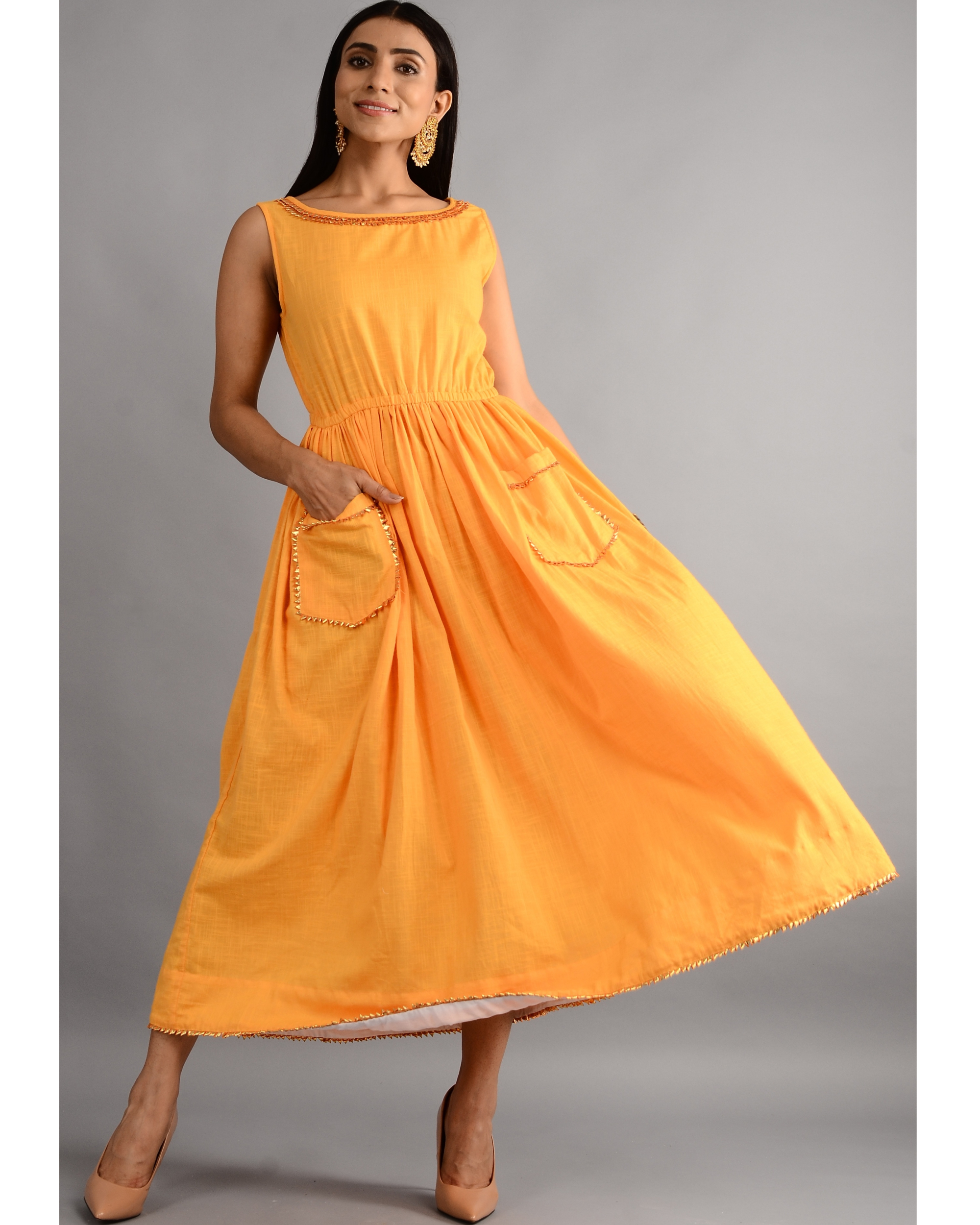 Mustard gota dress with front pockets by Free Living | The Secret Label