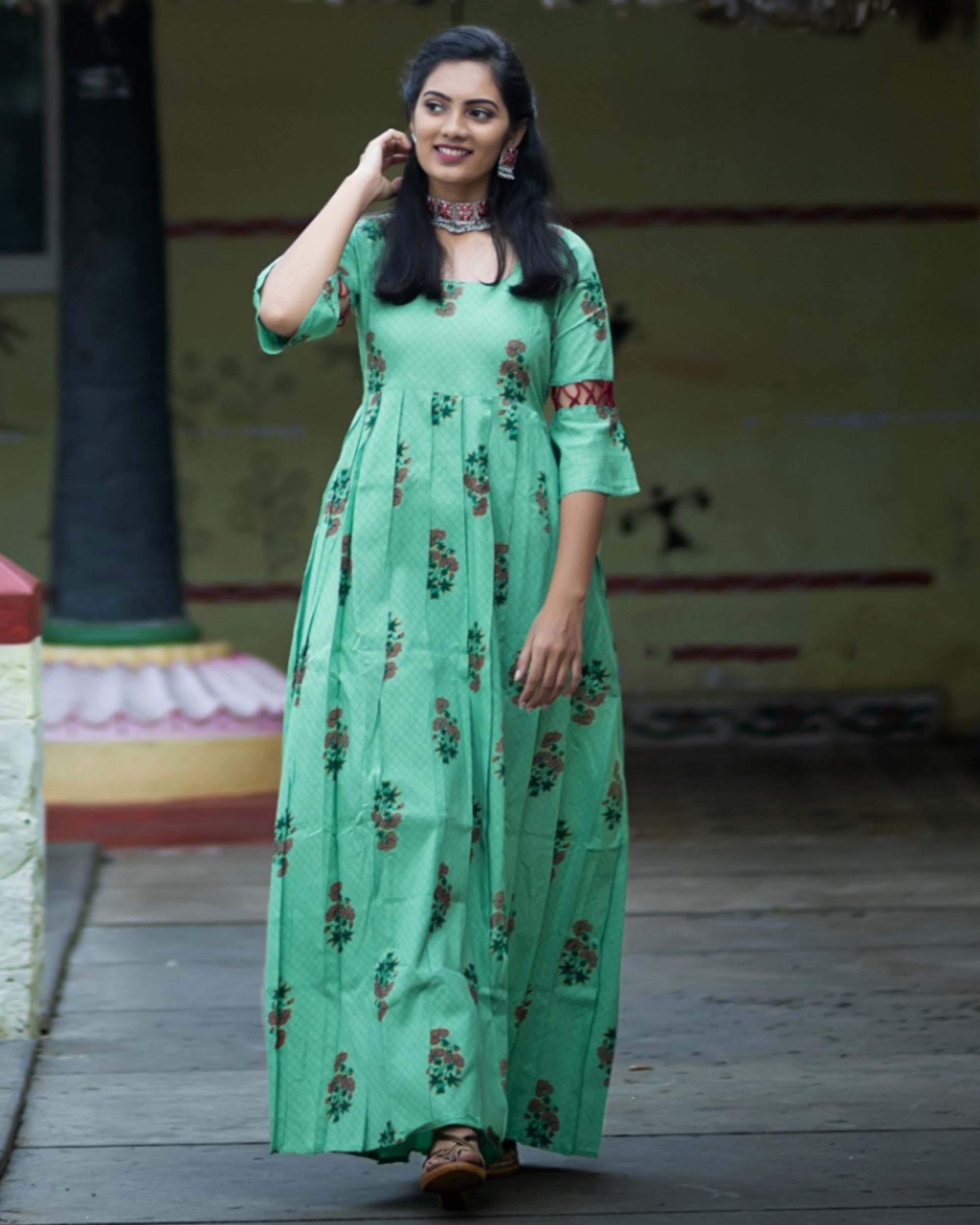 Pistachio green floral printed pleated dress with sleeve detailing