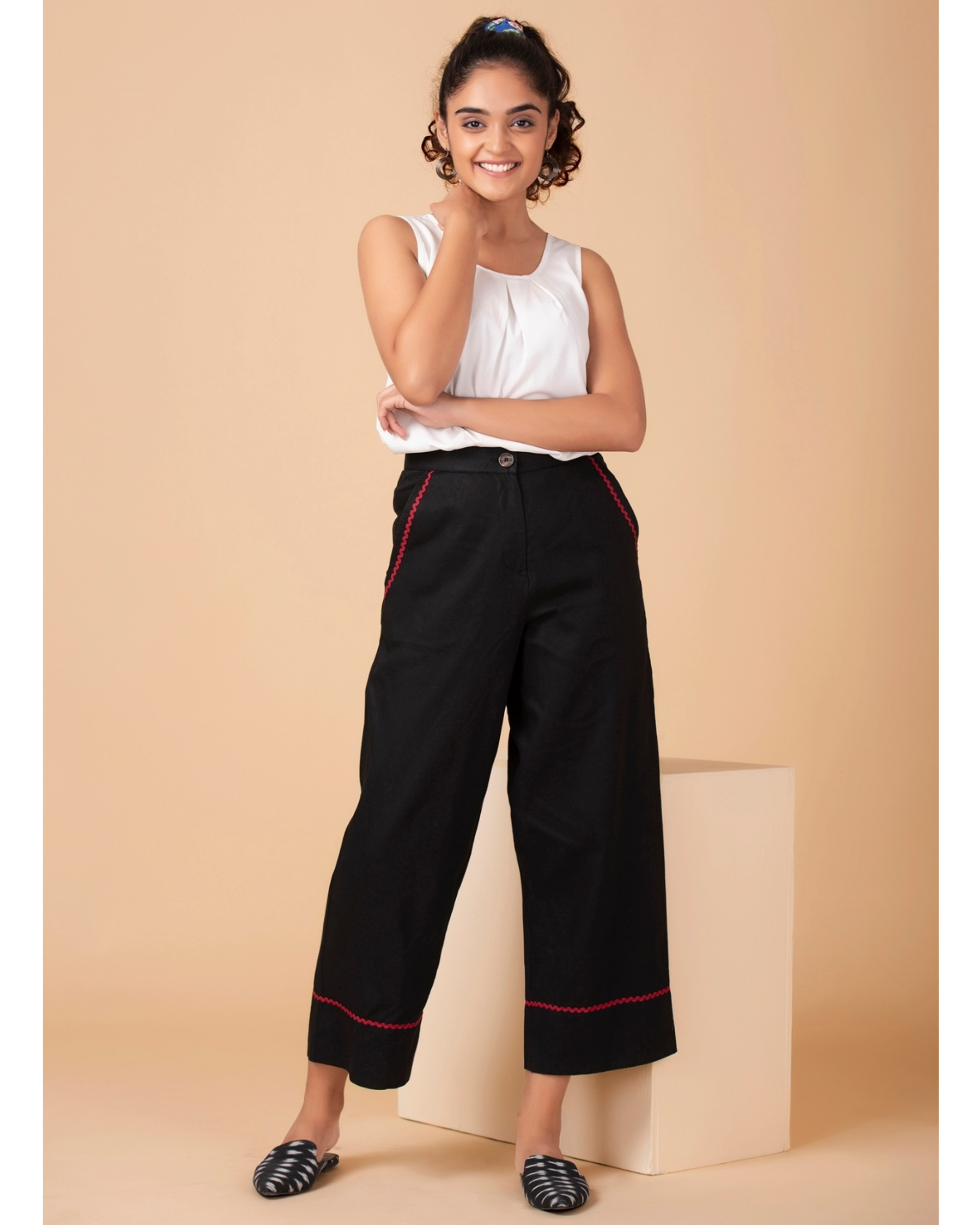 Black contrast trim pants by Twirl Studio | The Secret Label