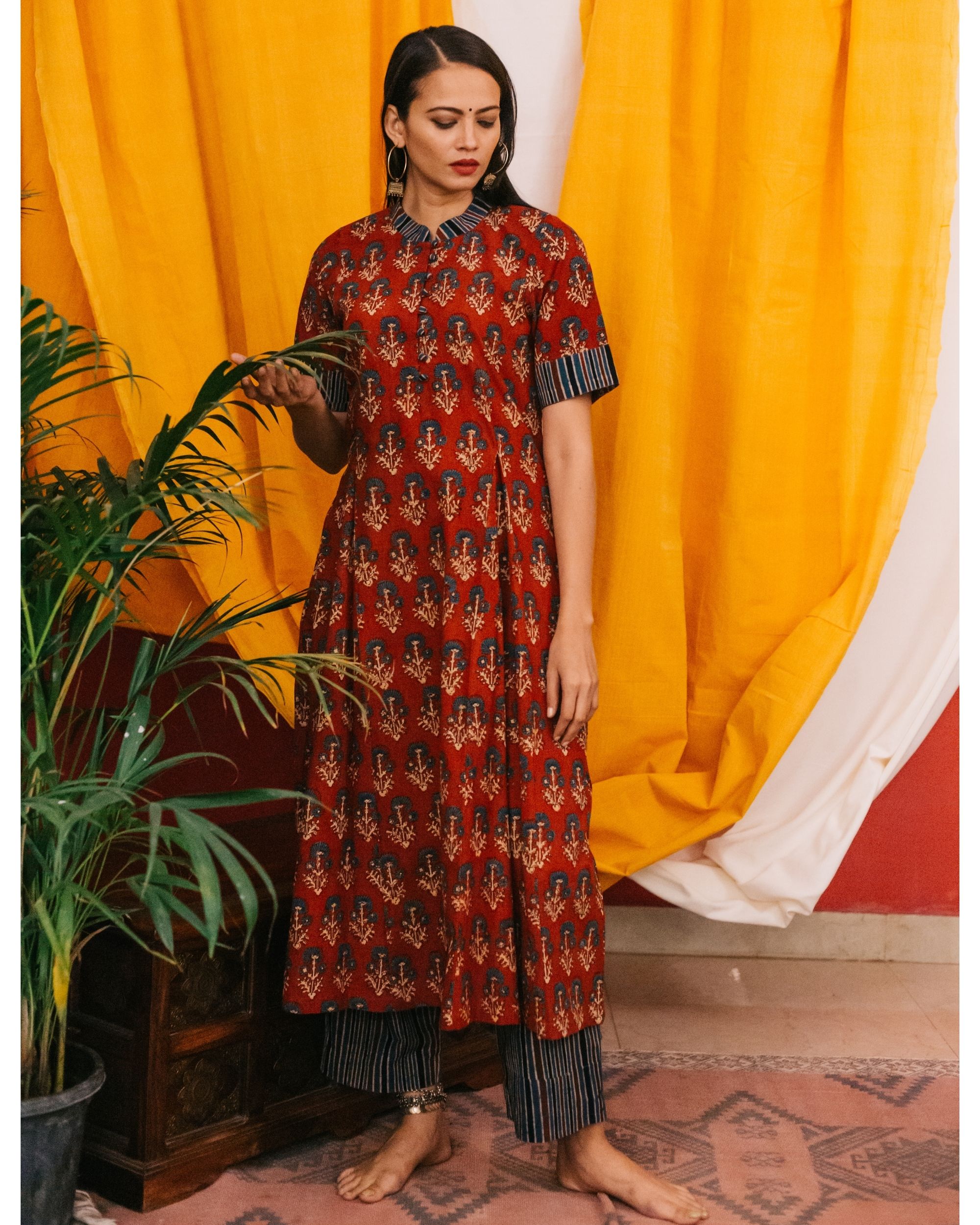 Red floral ajrakh kurta with striped pants- set of two by Raasleela