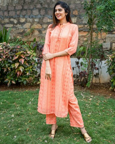Orange bandhani self embroidered kurta with pants - set of two by The ...