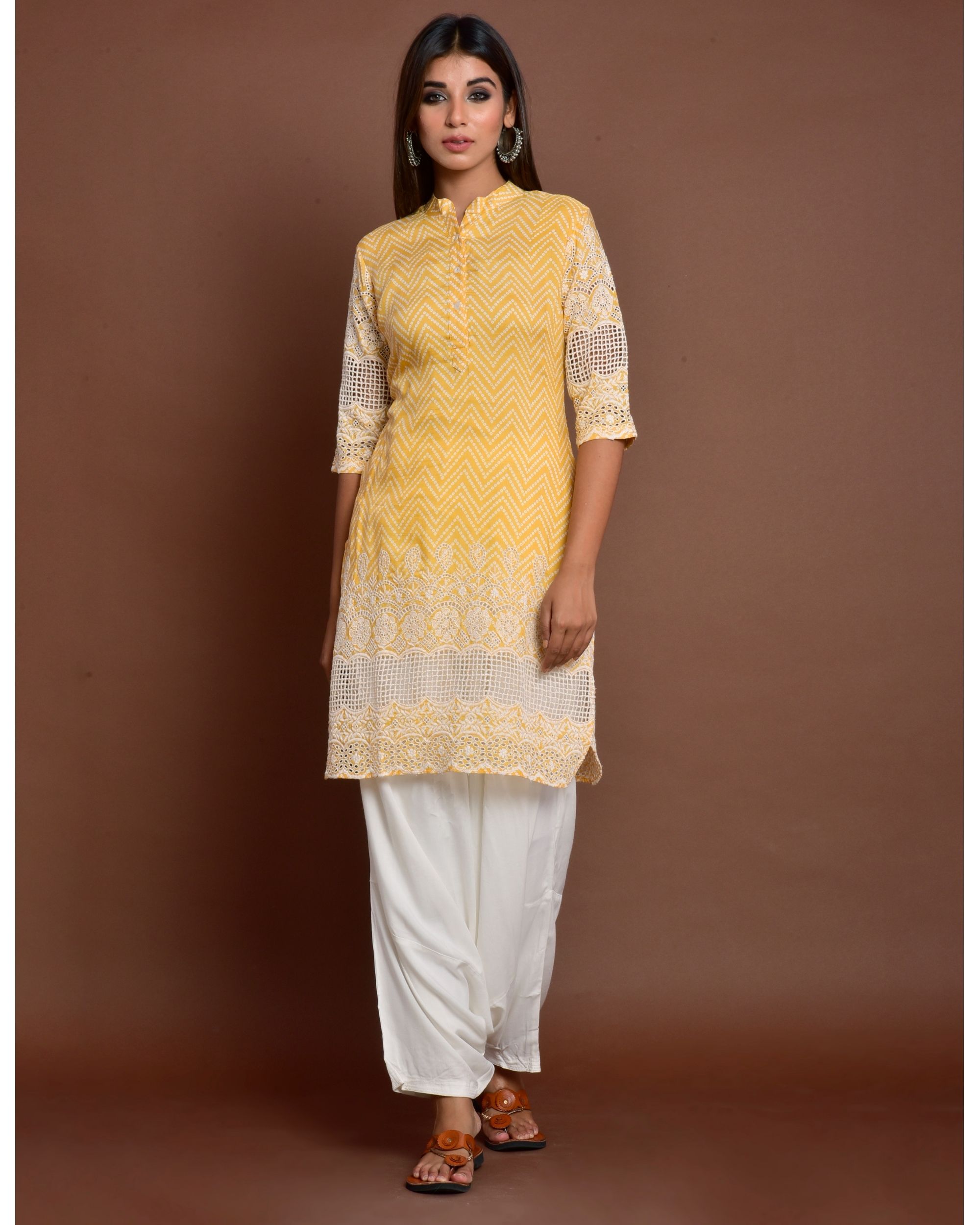 Yellow cutwork embroidered short kurta with off white patiala salwar - set of two