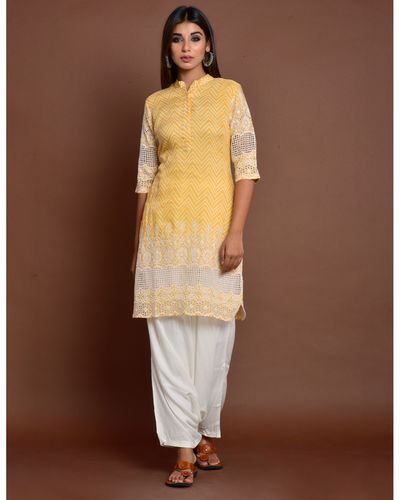 Yellow cutwork embroidered short kurta by Keva | The Secret Label