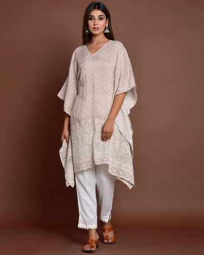 Dusty beige cutwork embroidered kaftan style kurta with white pants ...