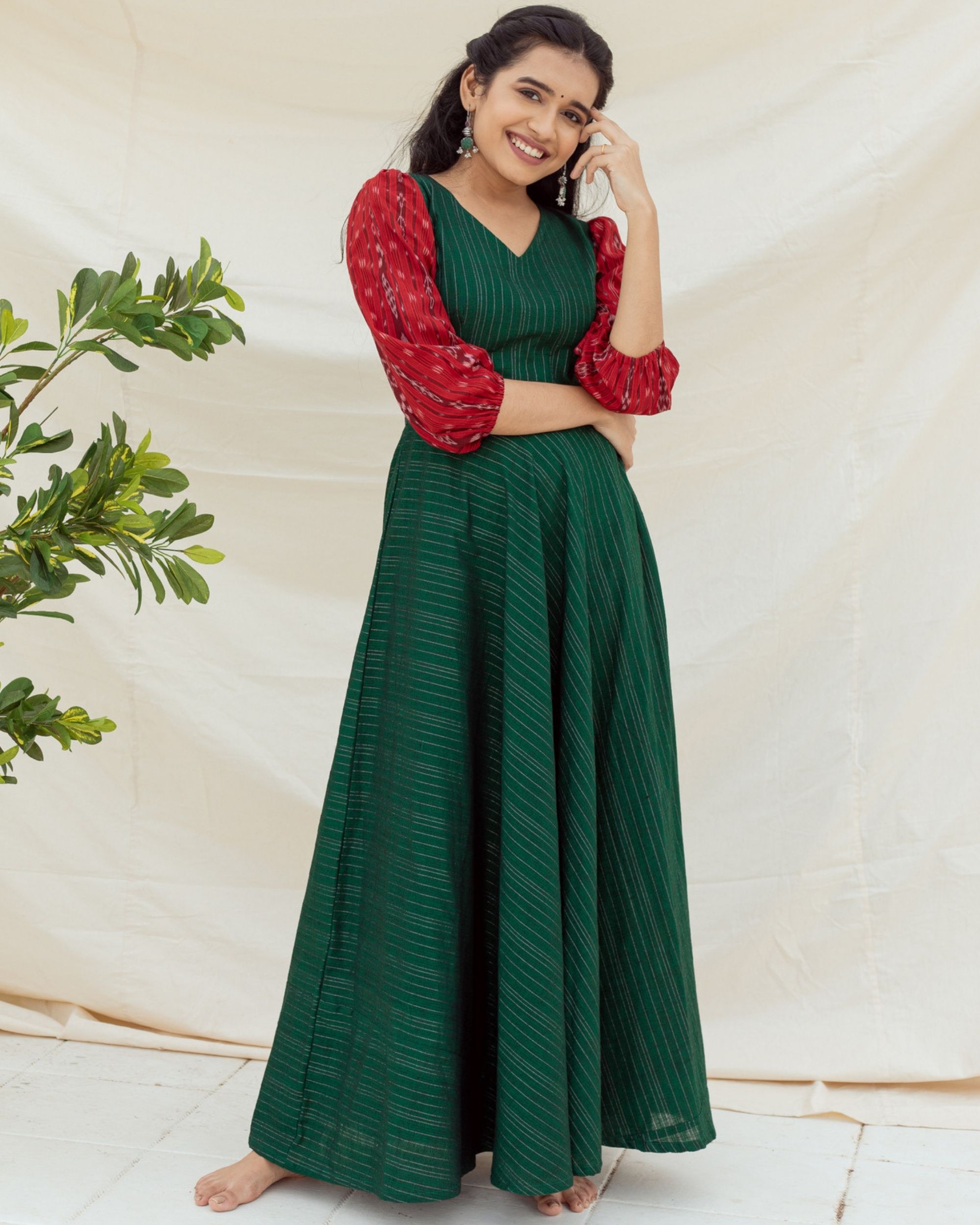 Bottle green handloom dress with red sambalpuri ikat sleeves