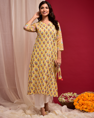 Yellow buti printed kurta with potli pouch by Naksh | The Secret Label