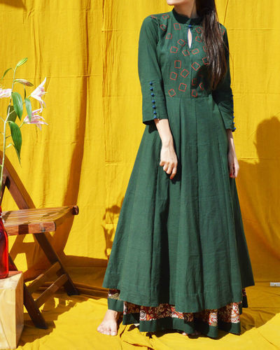 Green flared maxi dress by Silai | The Secret Label