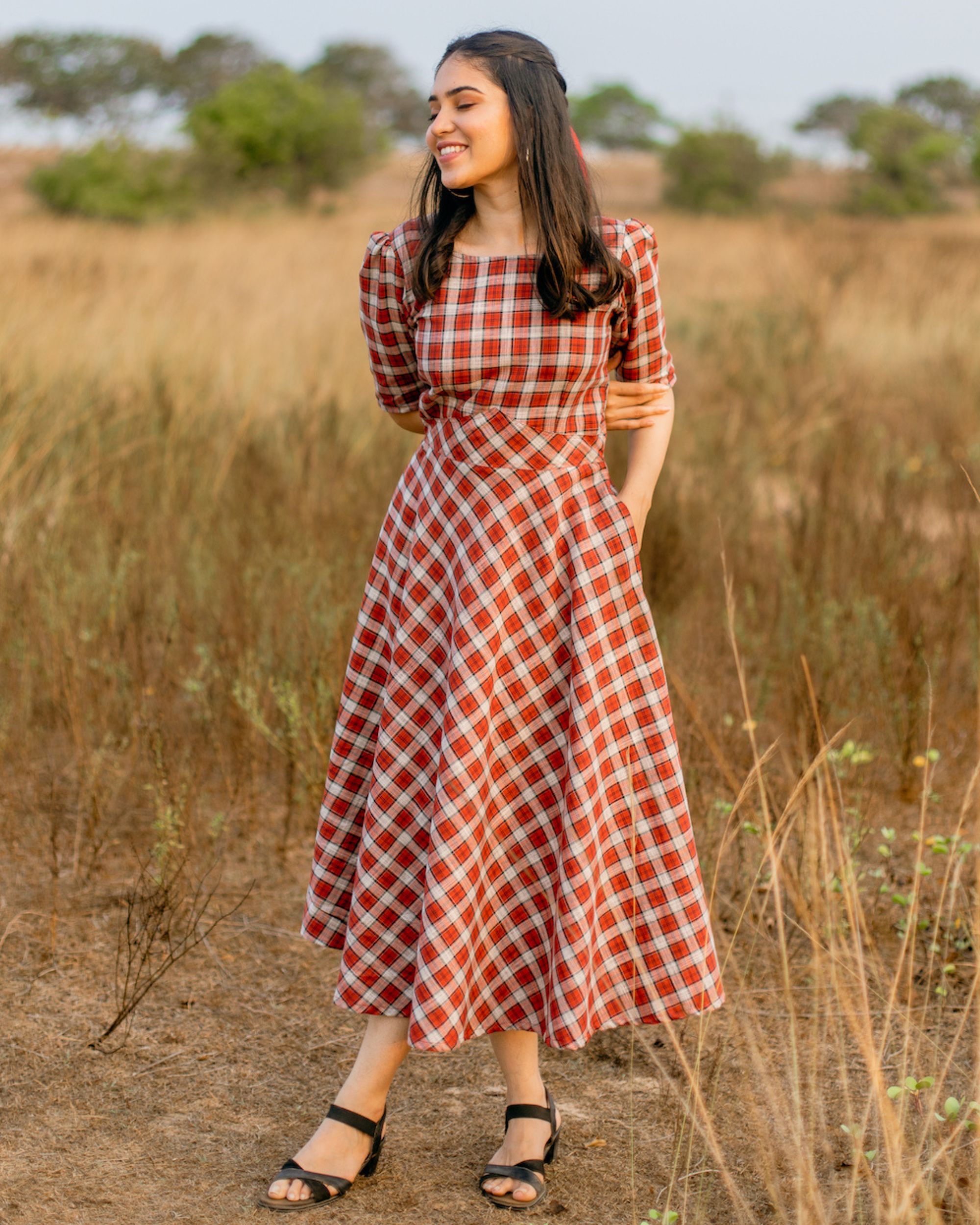 Red and white checks flared dress by Athira Designs