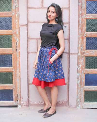 Red double layered skirt by Medhya
