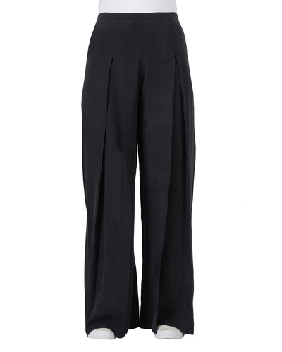 Black cupro front pleated pants by THREE | The Secret Label
