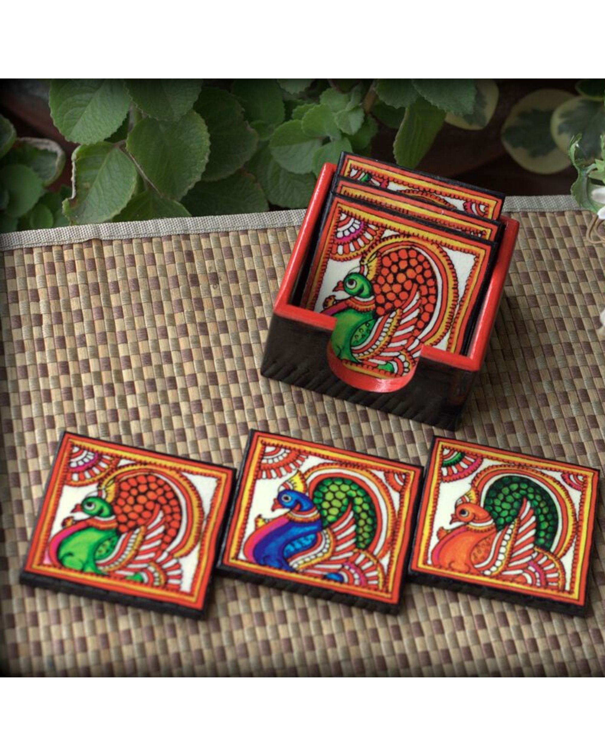 Tholu peacock wooden coasters with stand- Set Of Seven