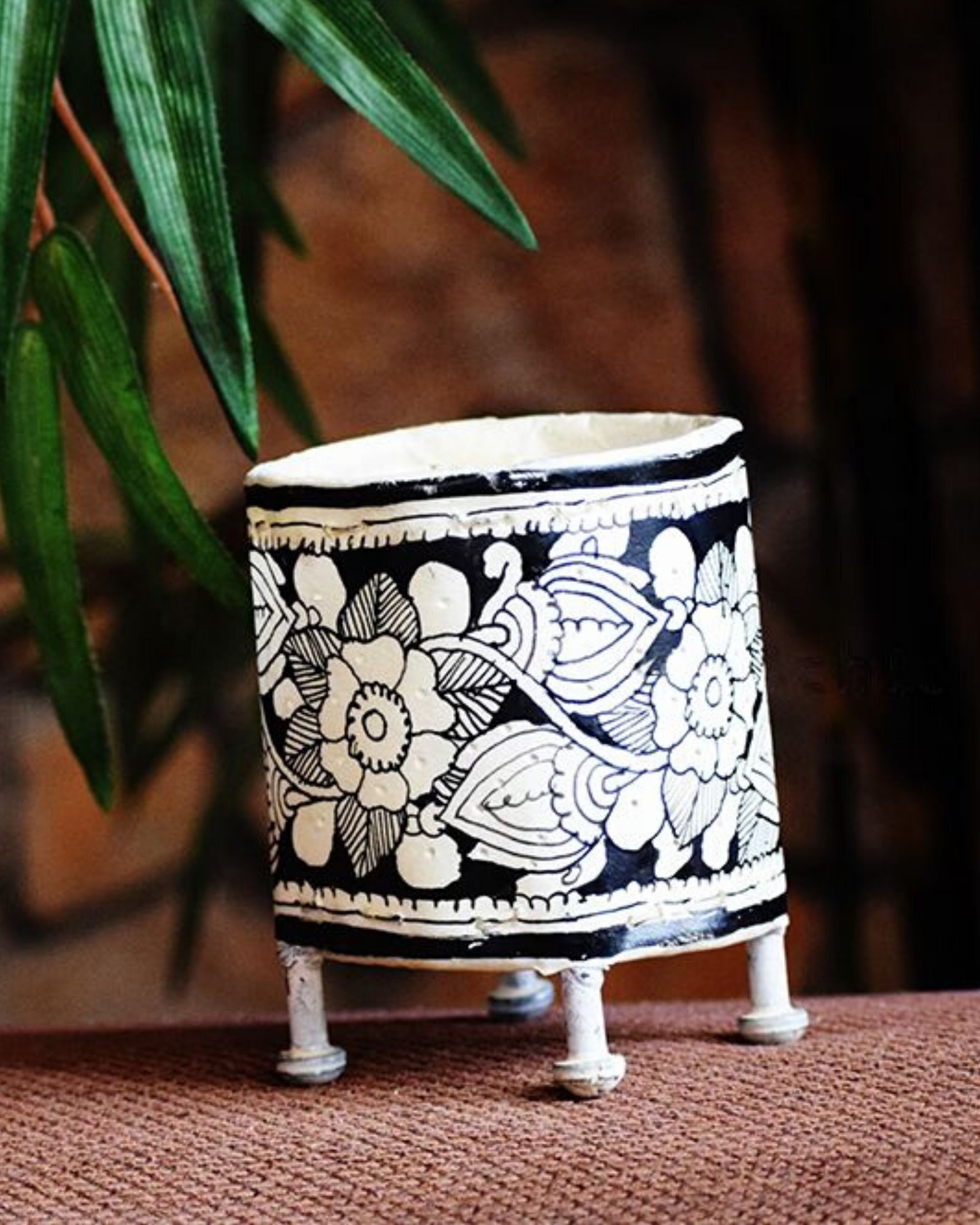 White and black hand painted votive stand