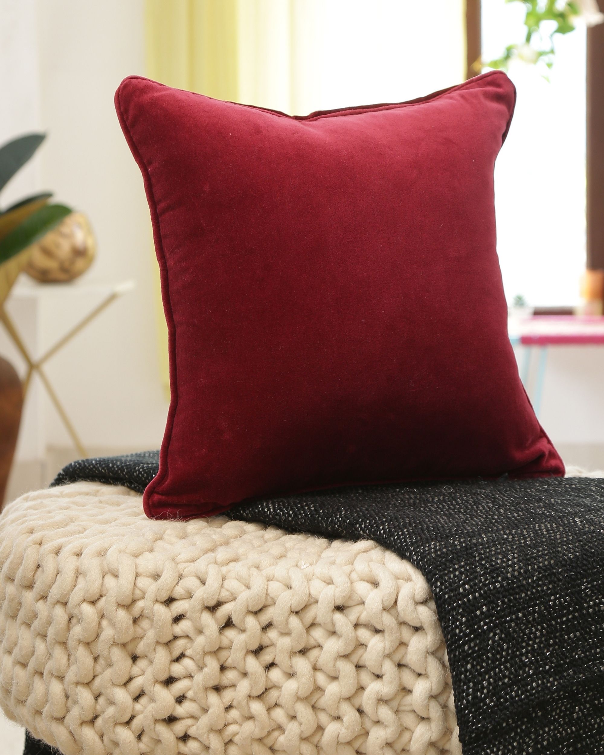 Burgundy velvet shop cushion