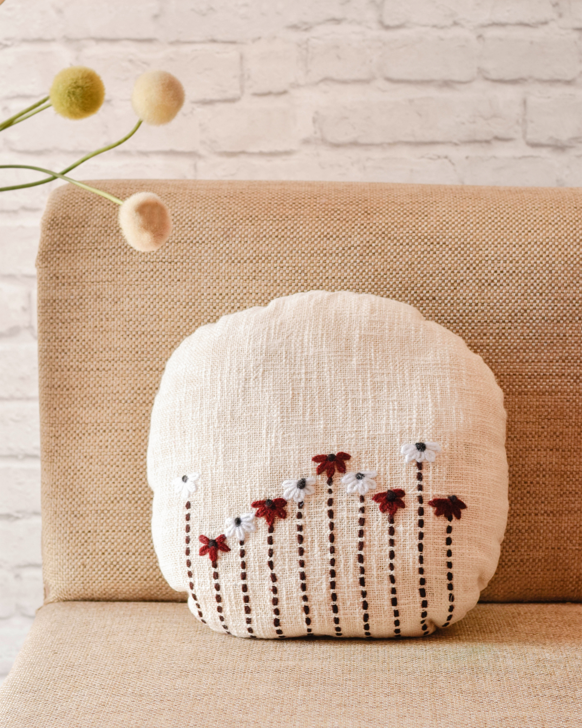 Off-white flora round cushion covers - set of two