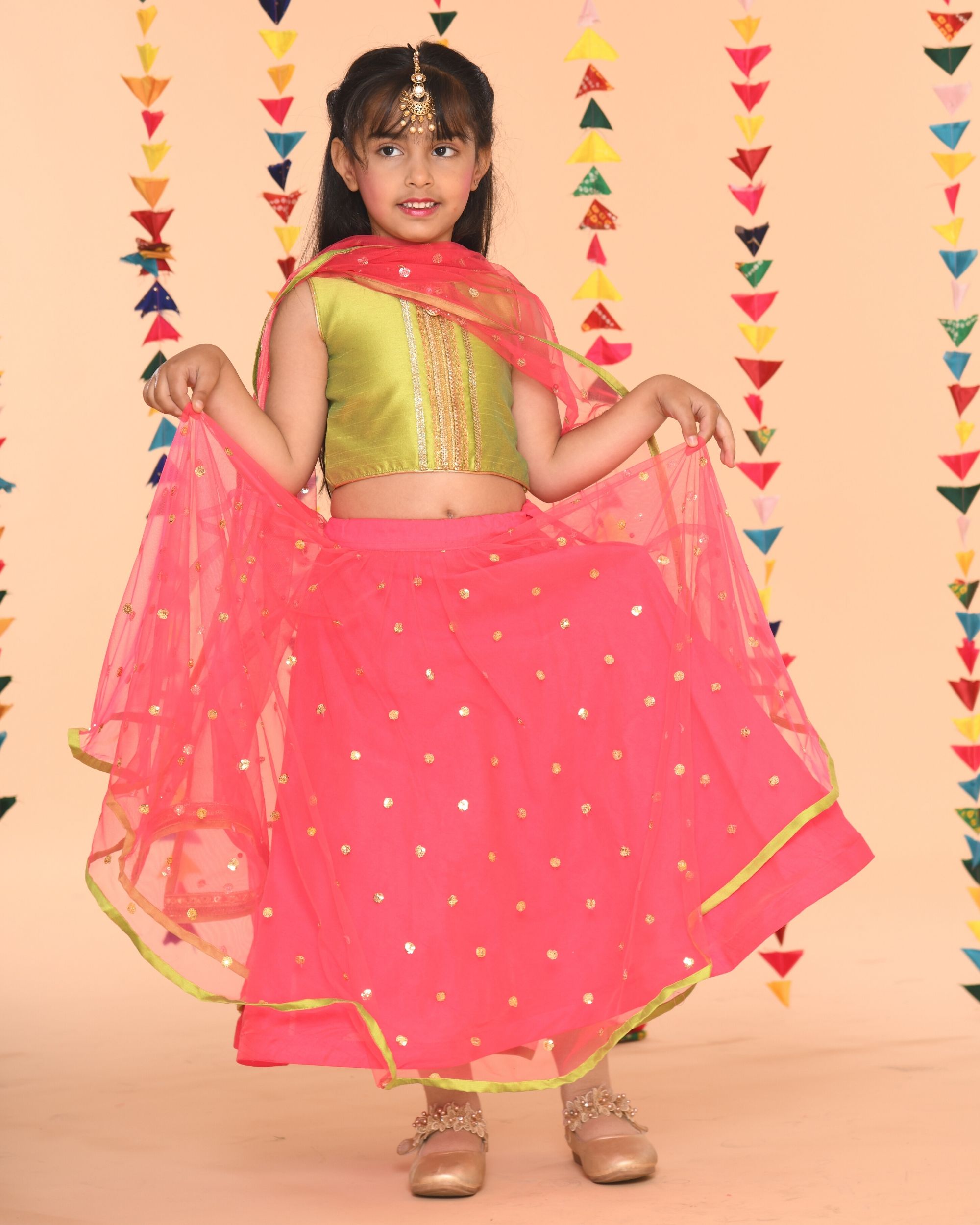 green lehenga with pink choli