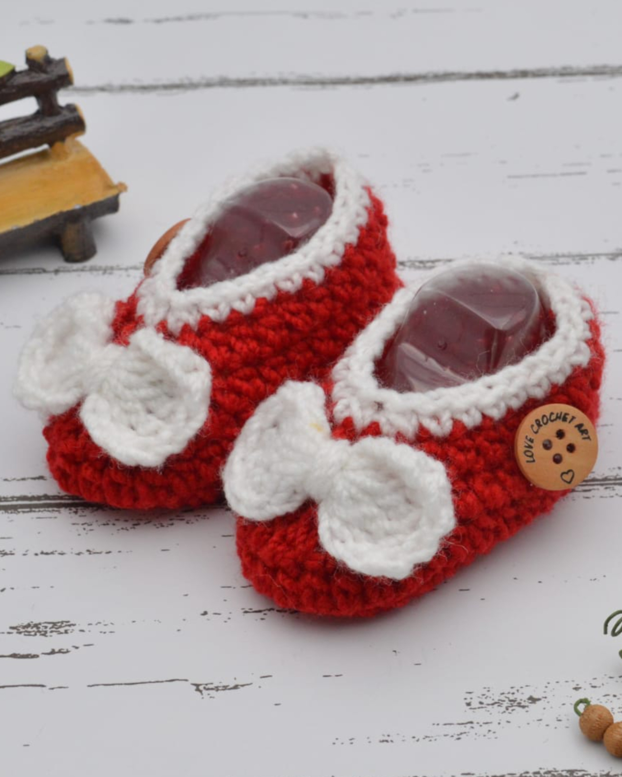 Red hand crocheted woollen booties
