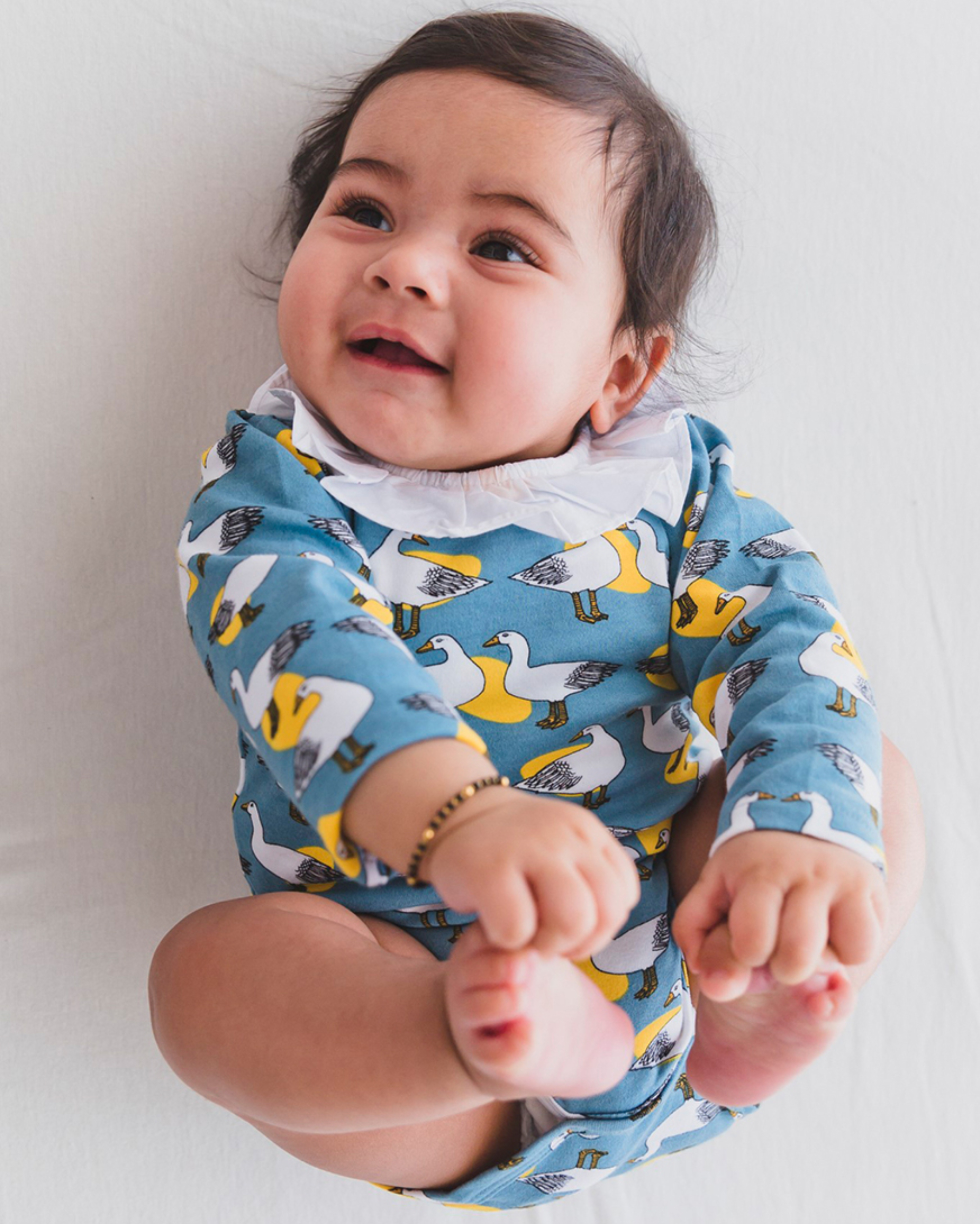 Blue cotton bird print onesie by Mamas Boo