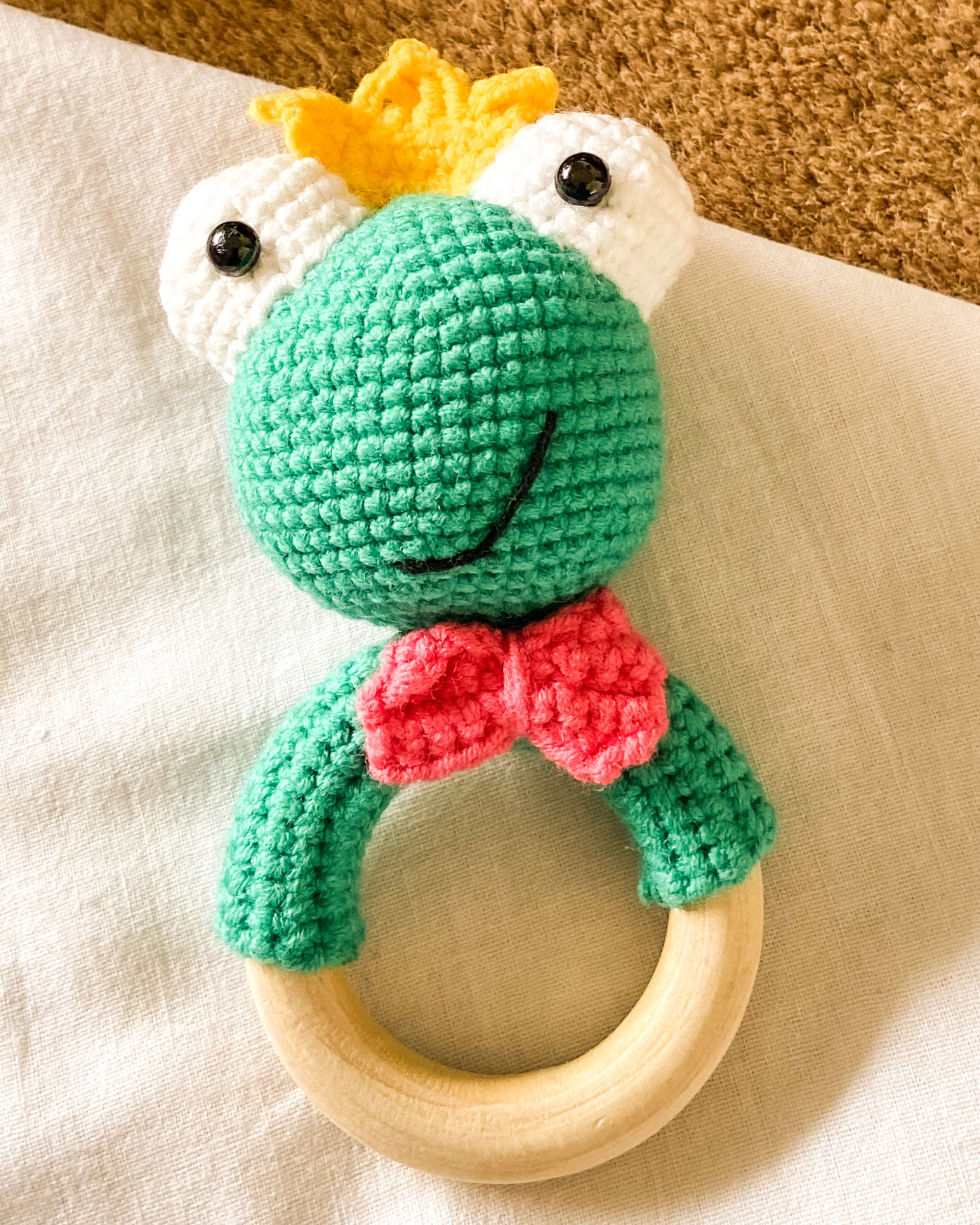 Hand crocheted baby sound rattle - frog