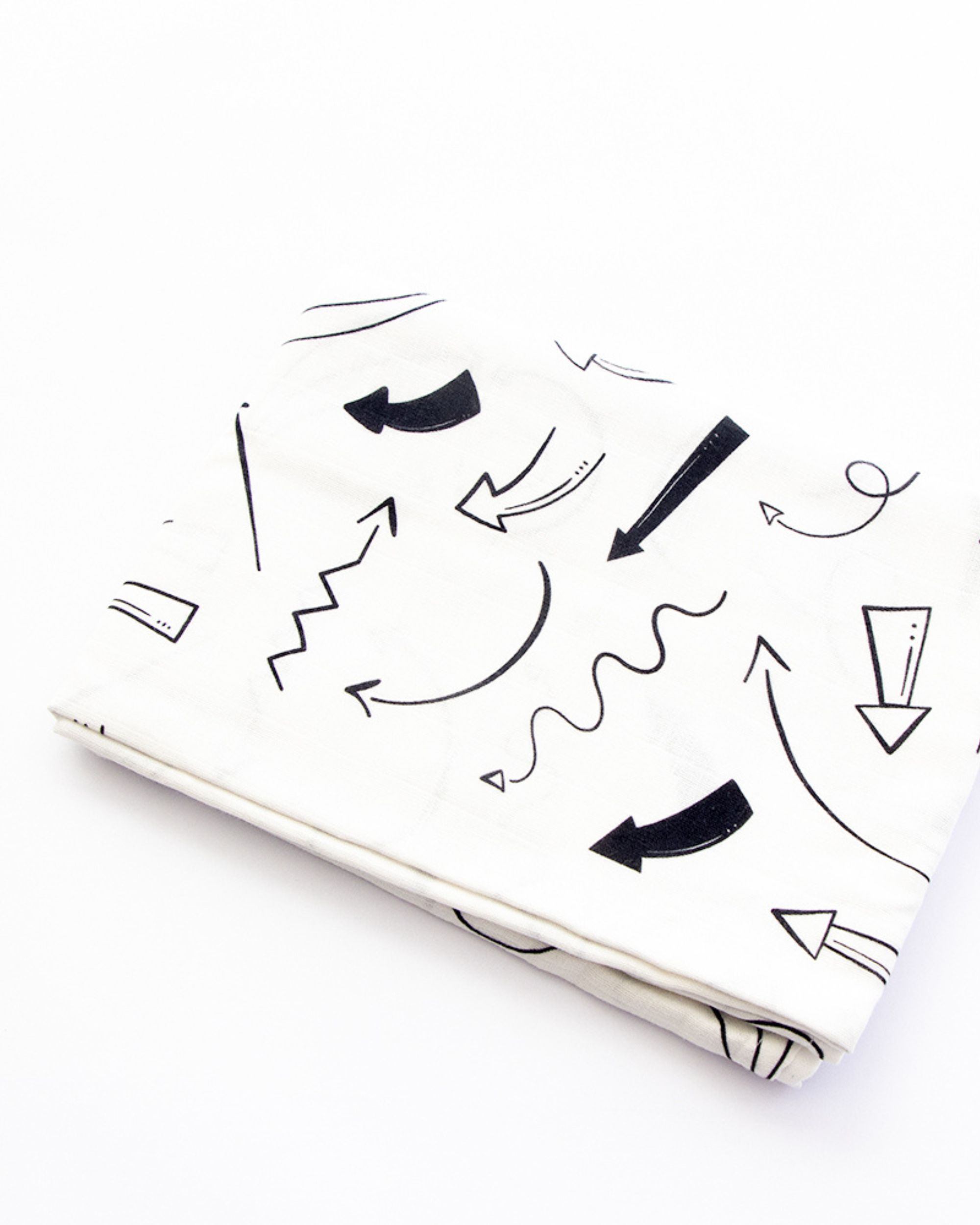 Black and white doodled muslin swaddle