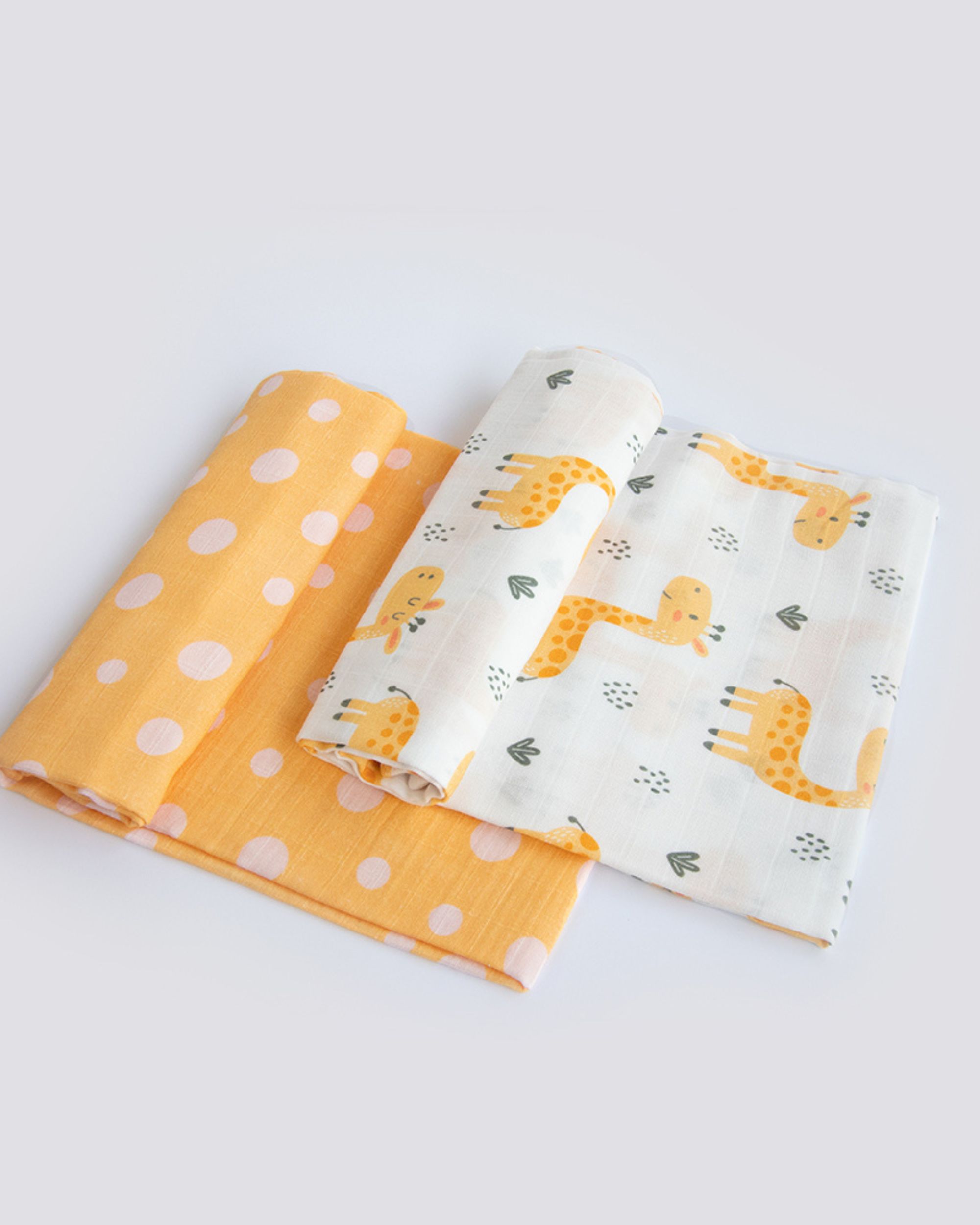 Baby giraffe and yellow polka printed swaddle - set of two