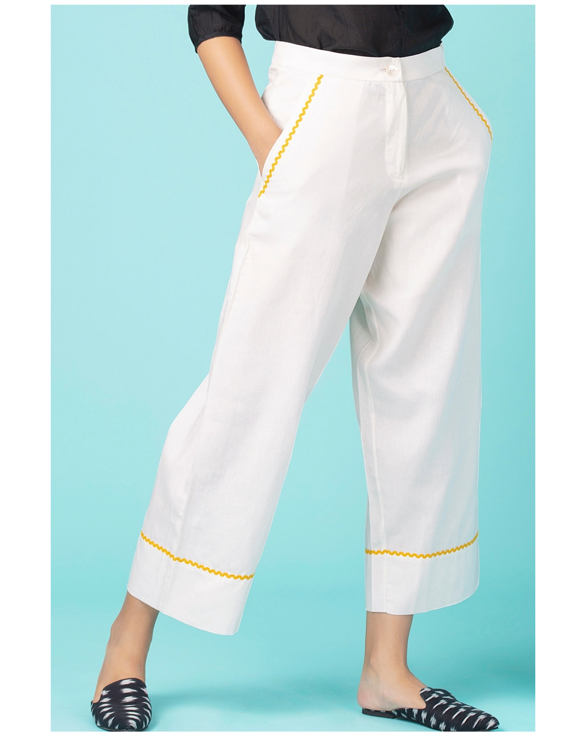 White contrast trim pants by Twirl Studio | The Secret Label