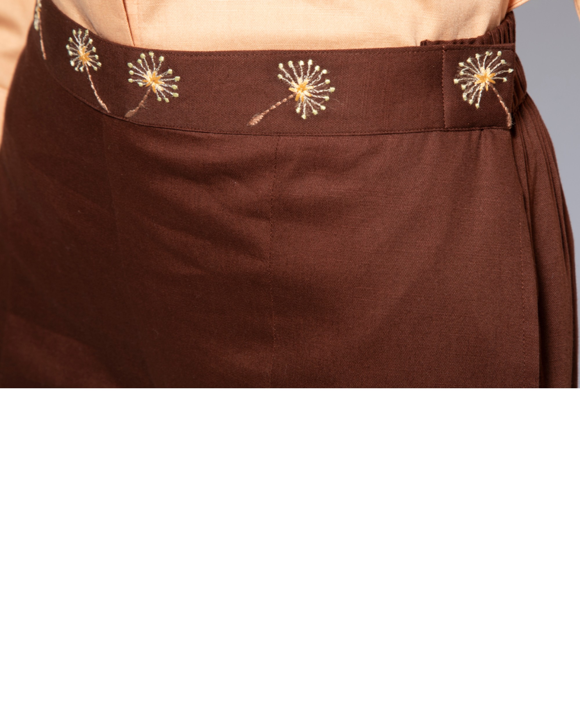 Dark brown embroidered flare pants by Santav