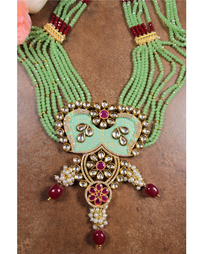 red onyx kundan necklace with emerald cutwork bead and pearls