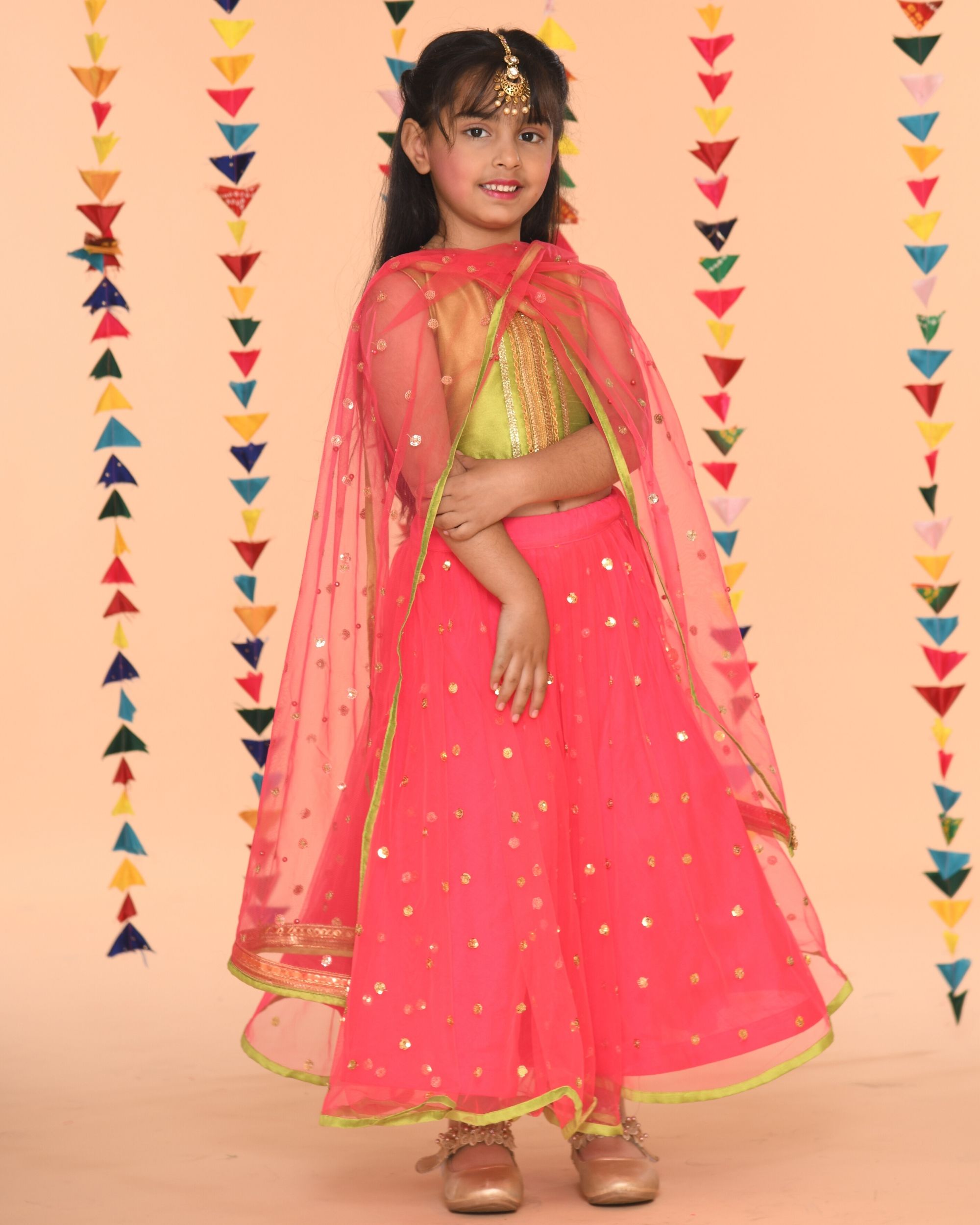 green lehenga with pink choli