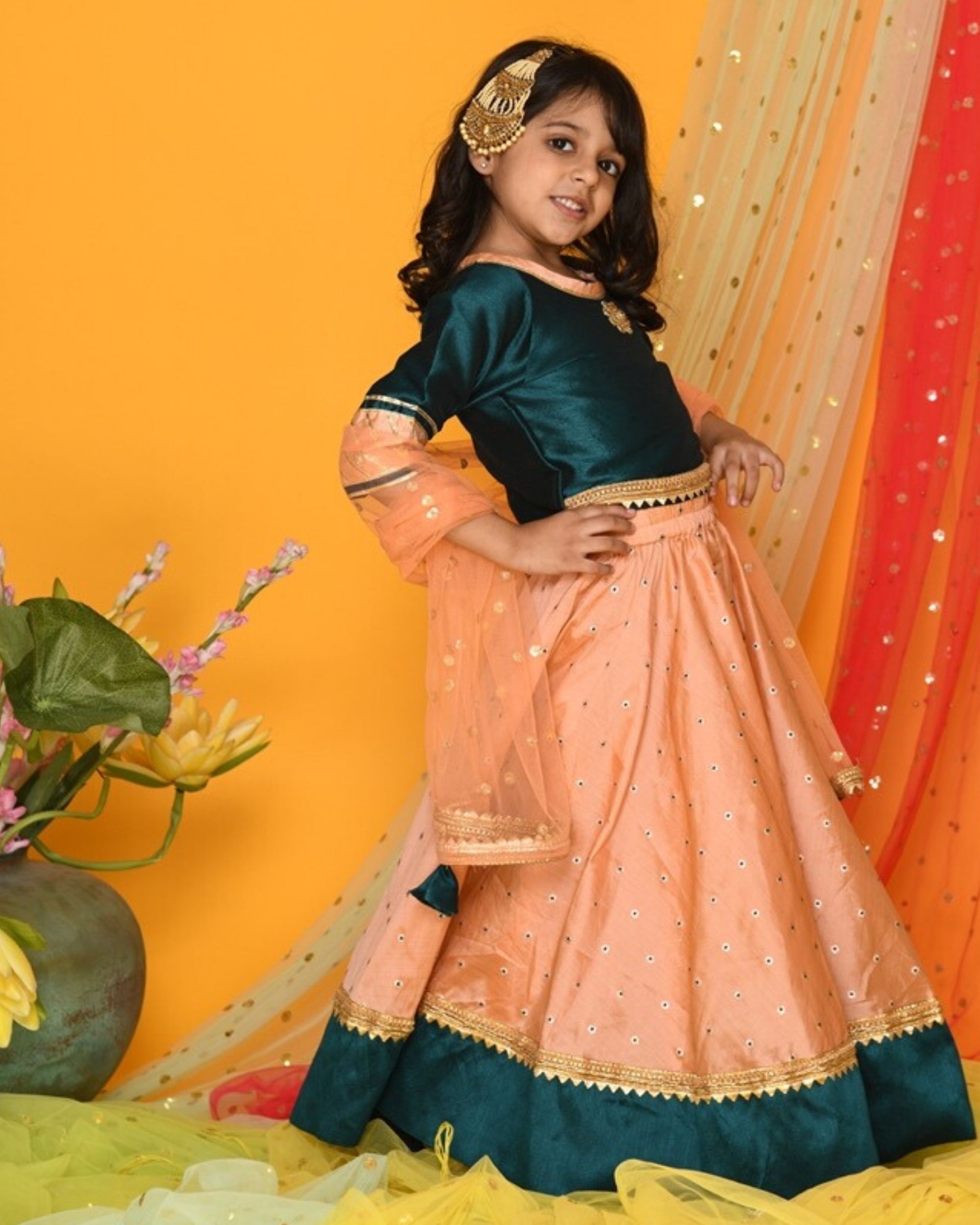 bottle green lehenga with red dupatta