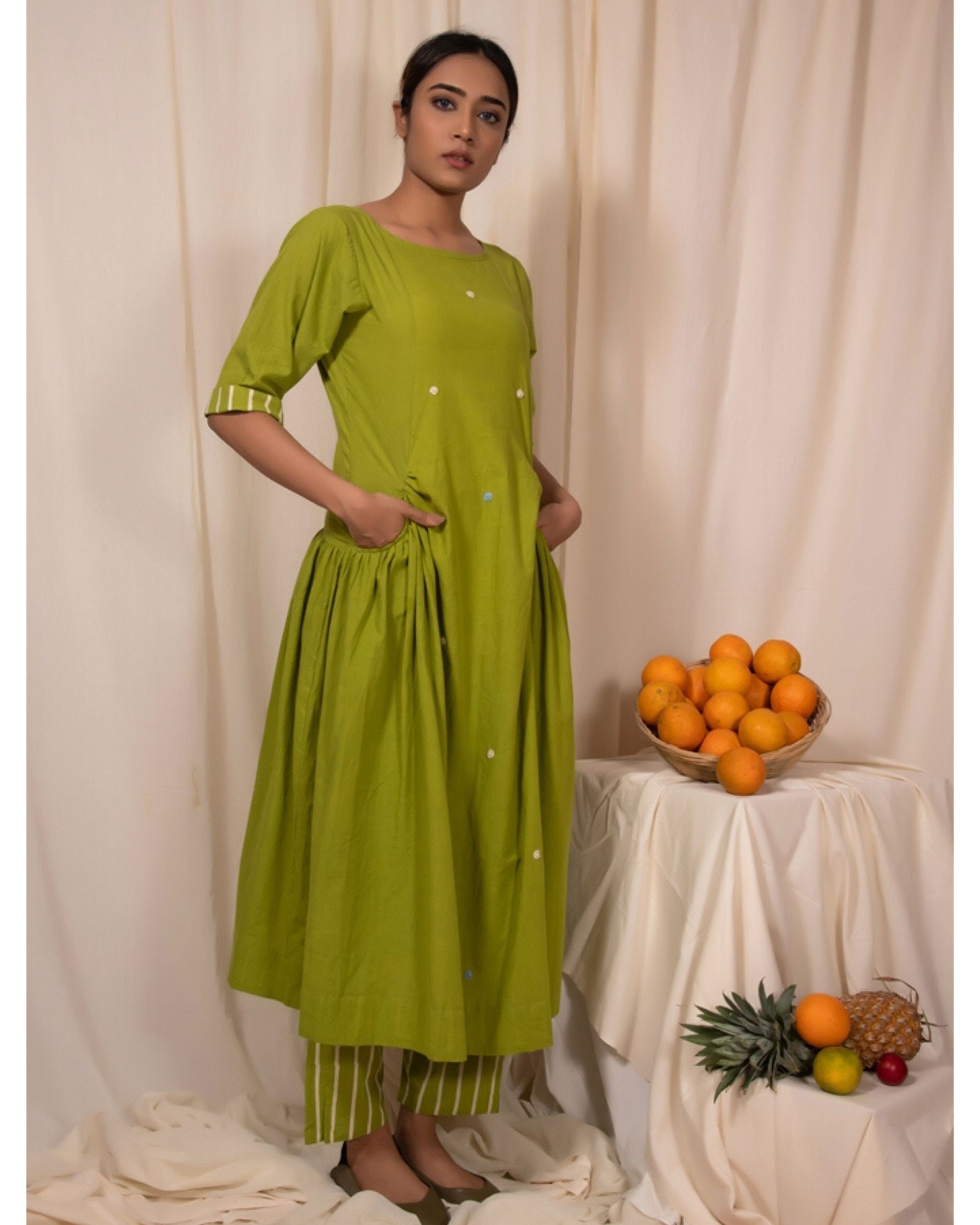 Lime green embroidered dress with pockets by Silai | The Secret Label