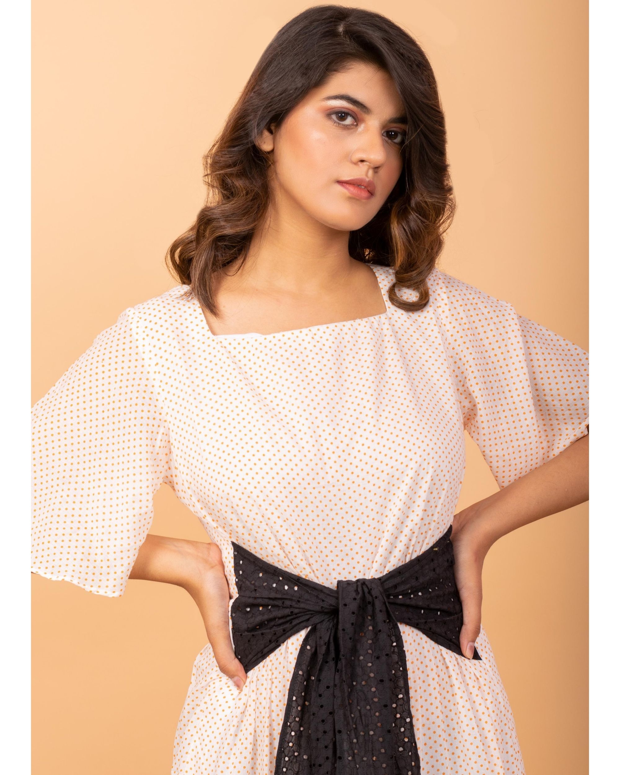 White polka printed ruffled dress with belt by Siddhi Creation The