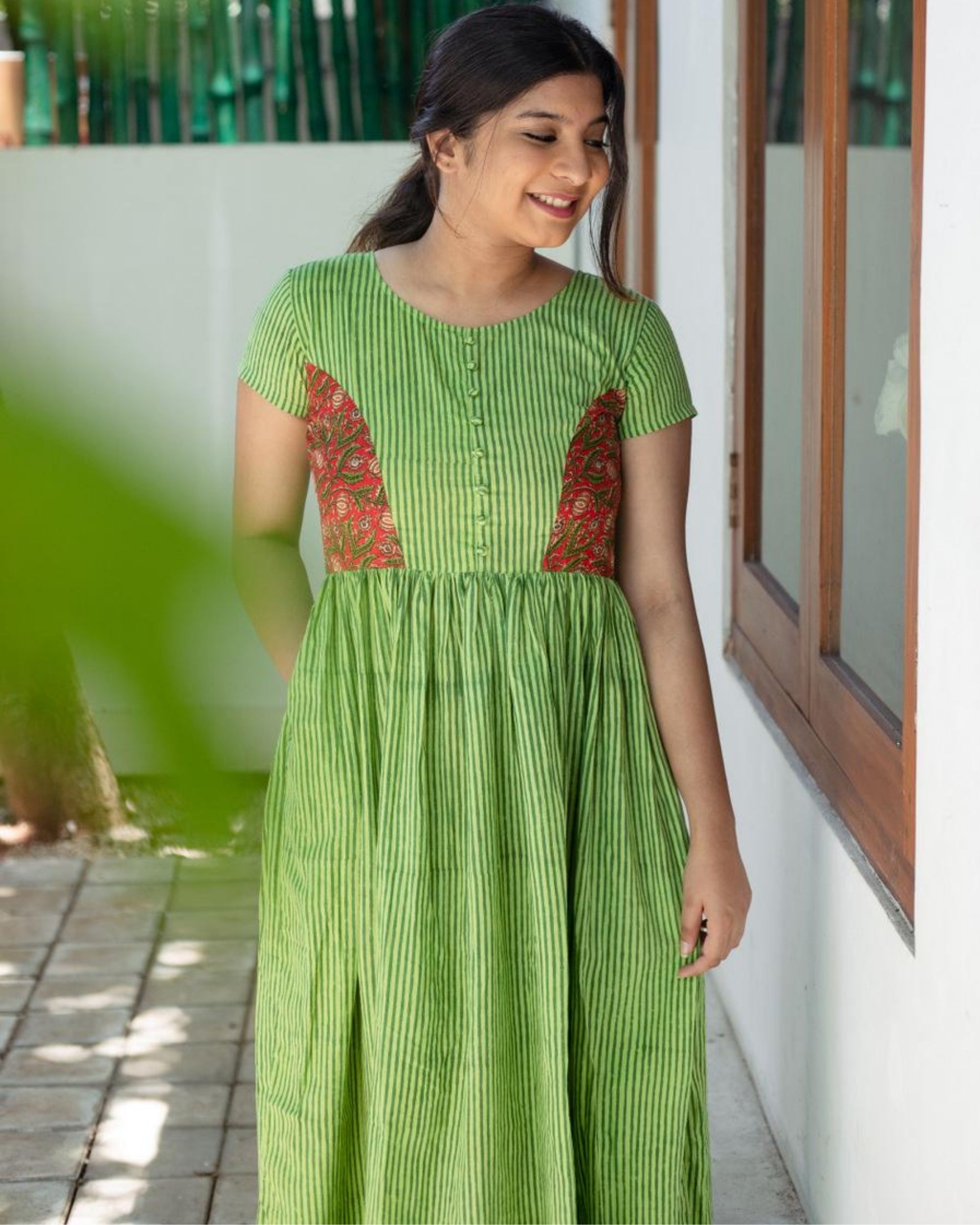 Leaf green striped midi dress by Athira Designs | The Secret Label