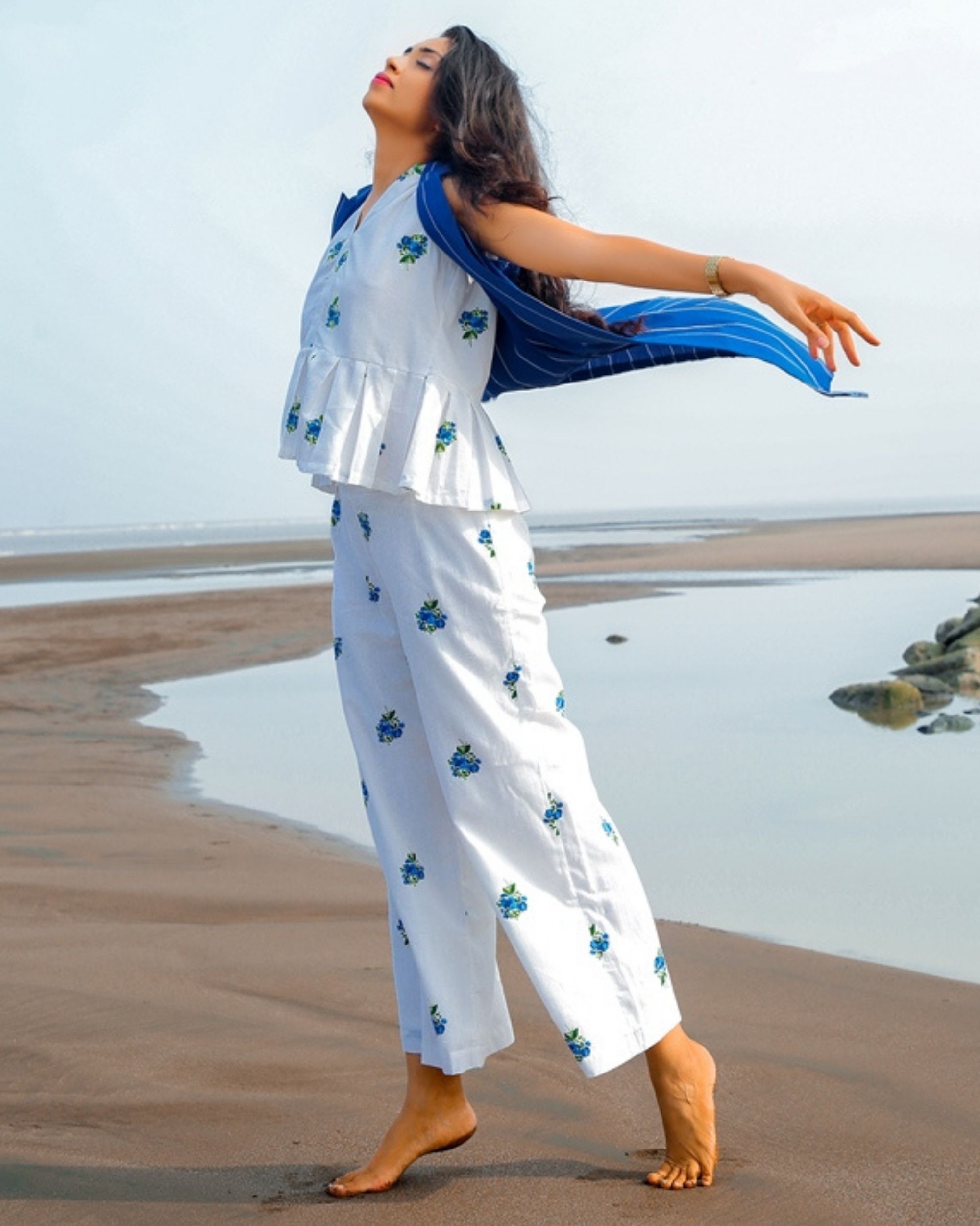 White and blue floral printed peplum top by The Cutting Story | The ...