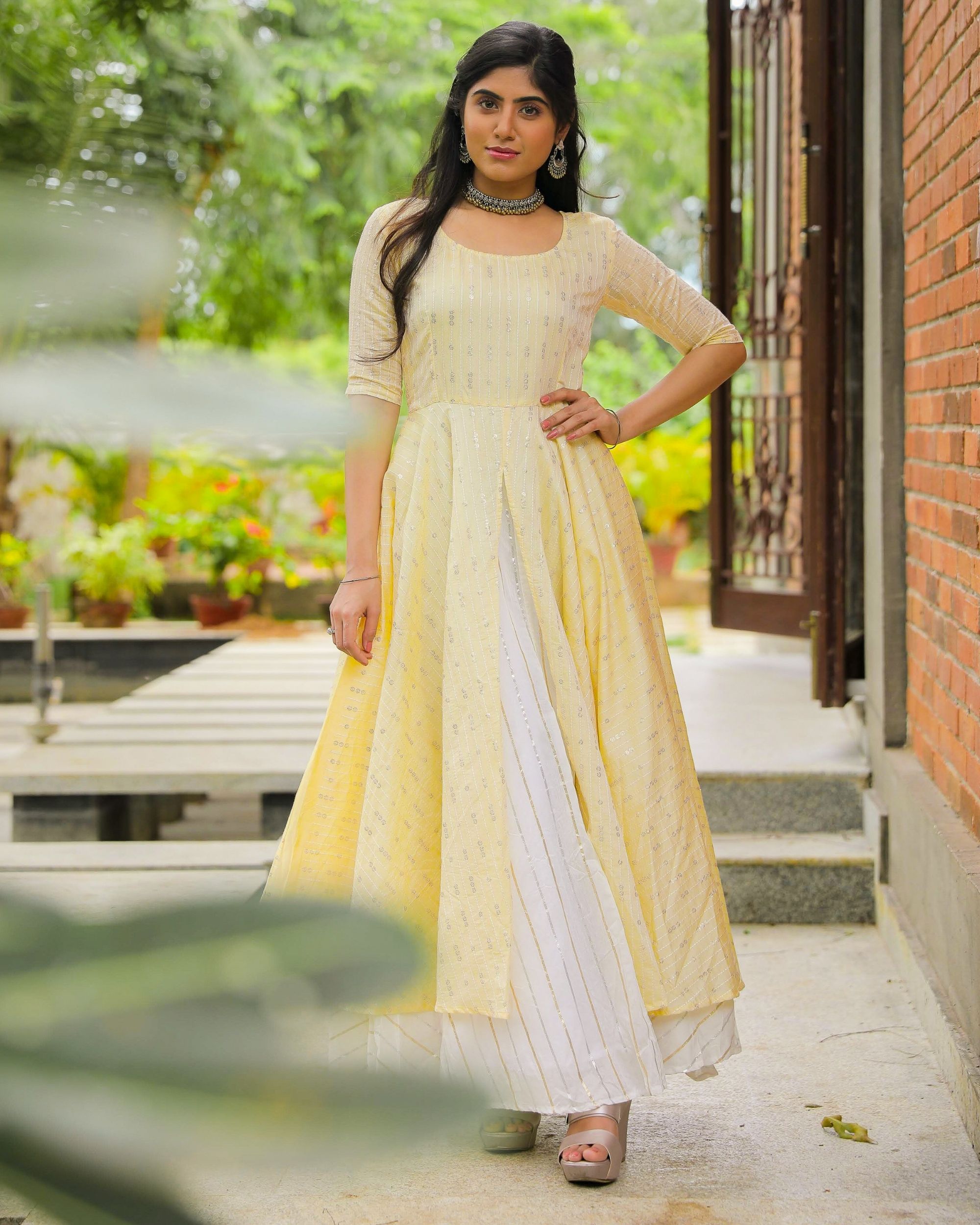 Light yellow layered striped dress with sequins detailing by Magizham ...