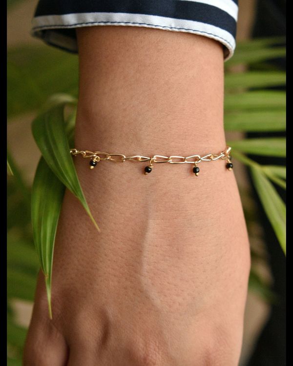 Looped strings and beads bracelet 1