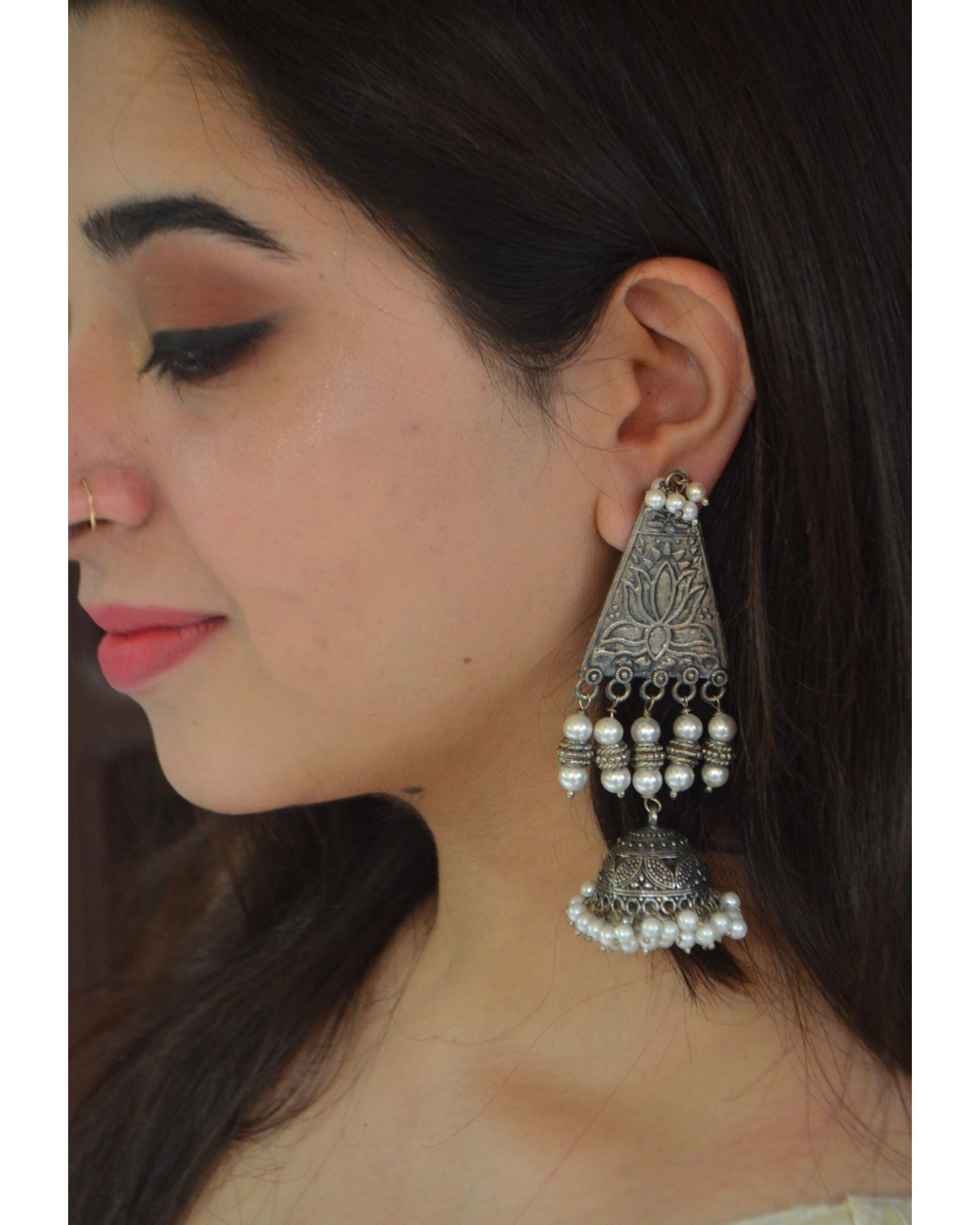 Trikoni lotus engraved jhumka by Heer House Of Jewellery | The Secret Label