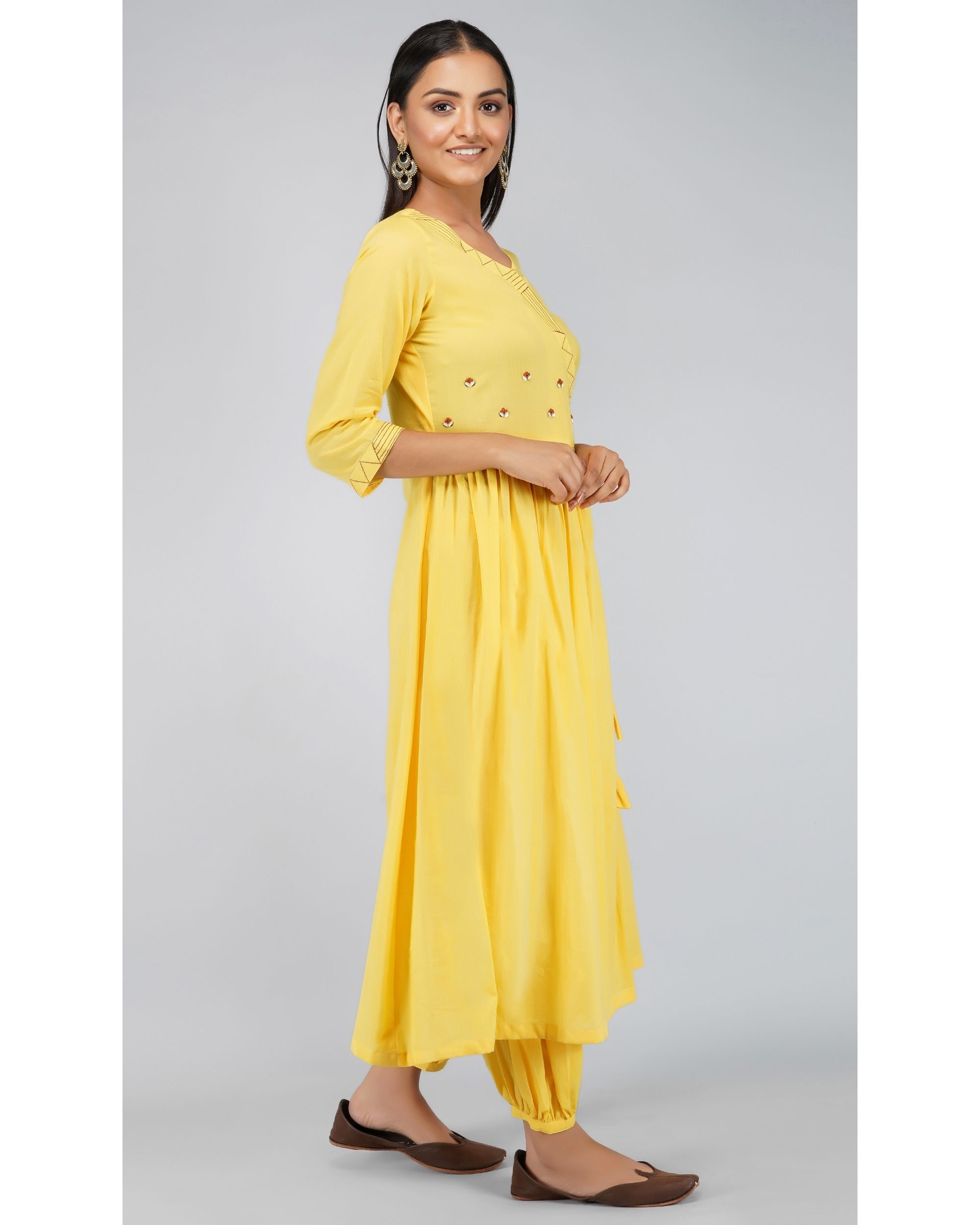 Yellow angrakha kurta with pleated pants by Svaroop Apparel | The ...