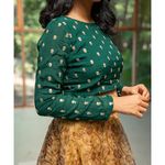 Green embroidered crop top and yellow organza skirt set of two by Athira Designs The Secret Label